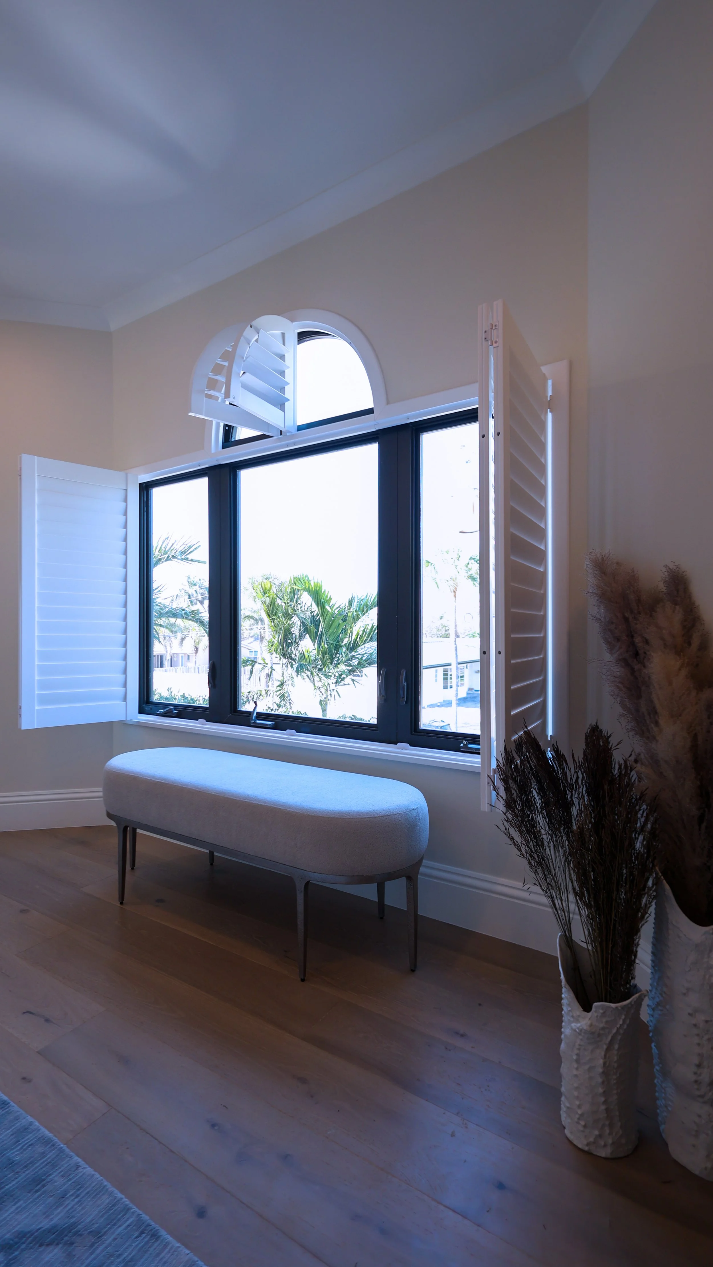 White plantation blinds in hallway