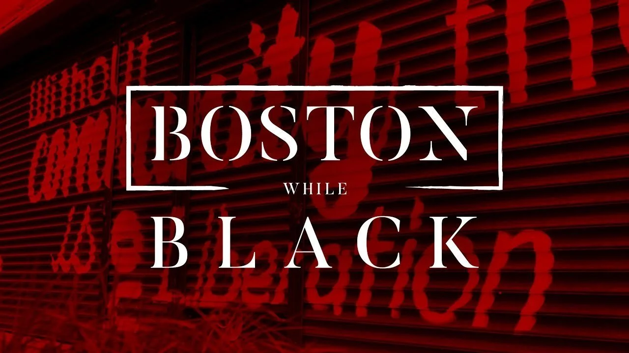 Red shutter door with bold white text that reads "Boston While Black."