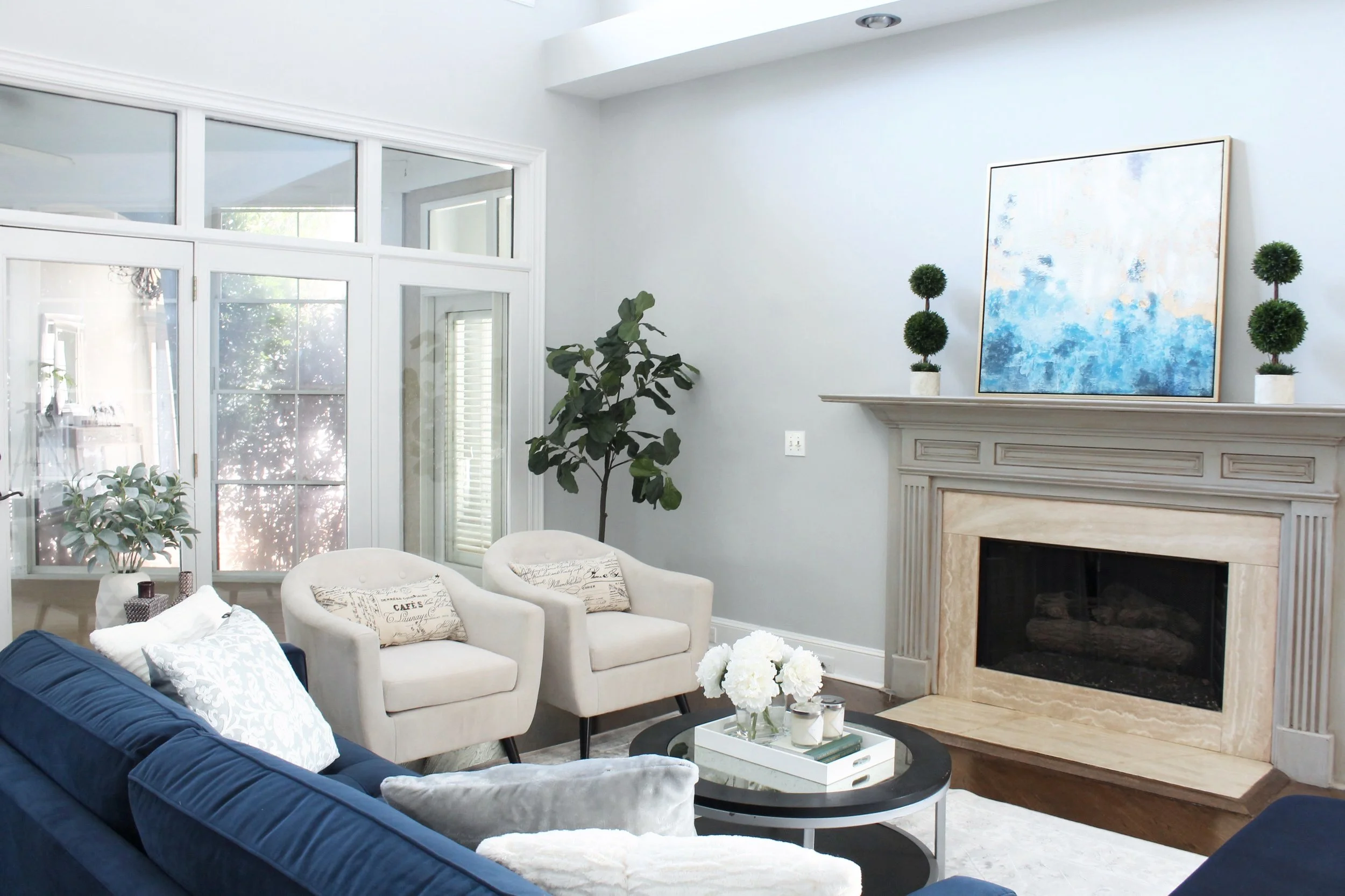 Living room fireplace gray armed chairs