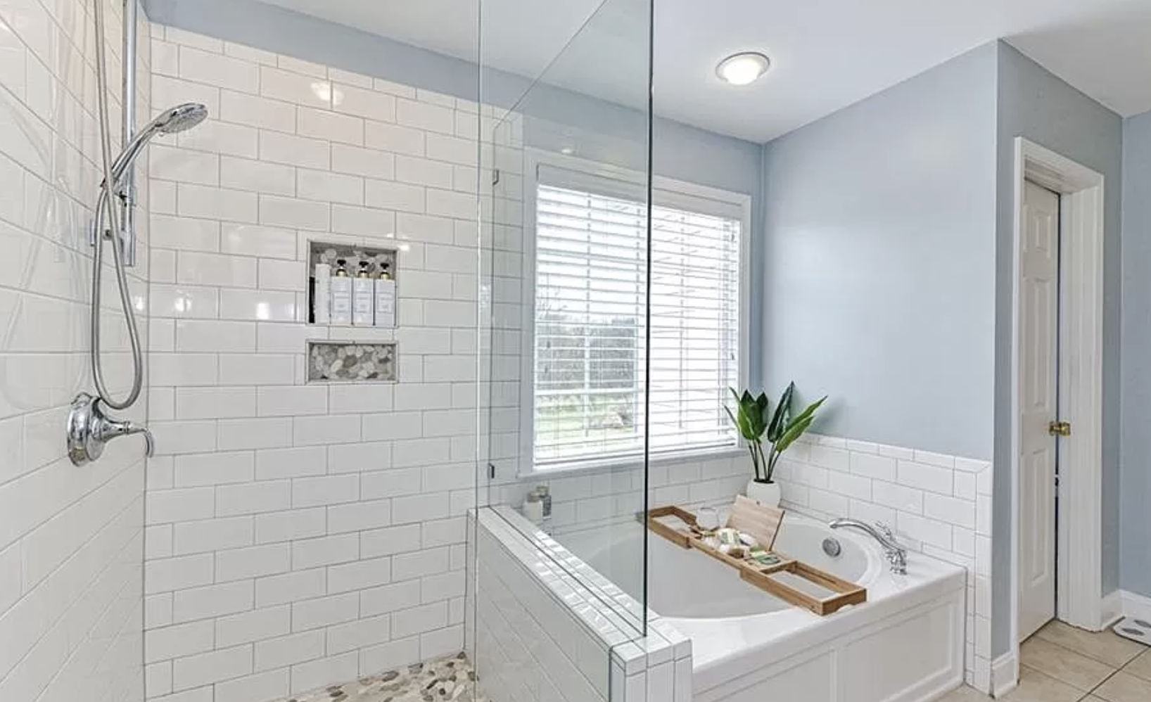 Master bathroom frameless shower and tub