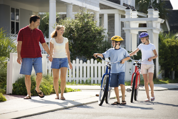 kids biking with their parents