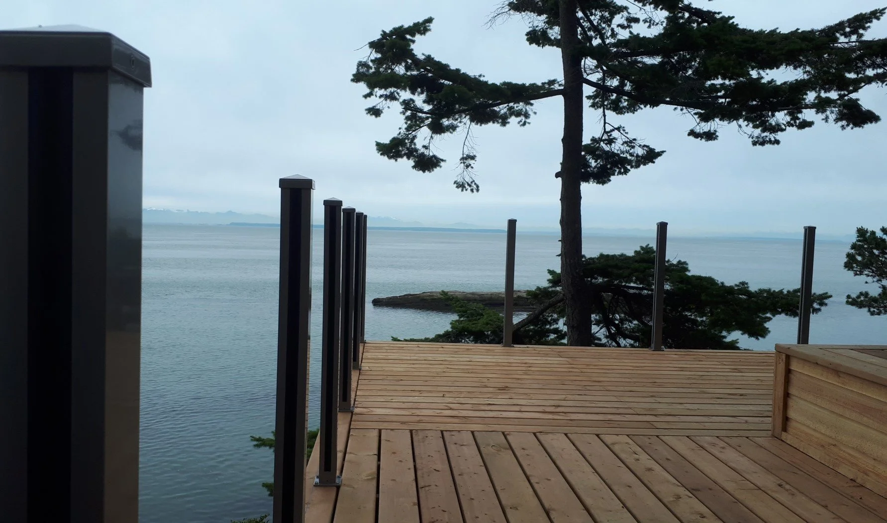 pressure treated decking with infinity glass railing