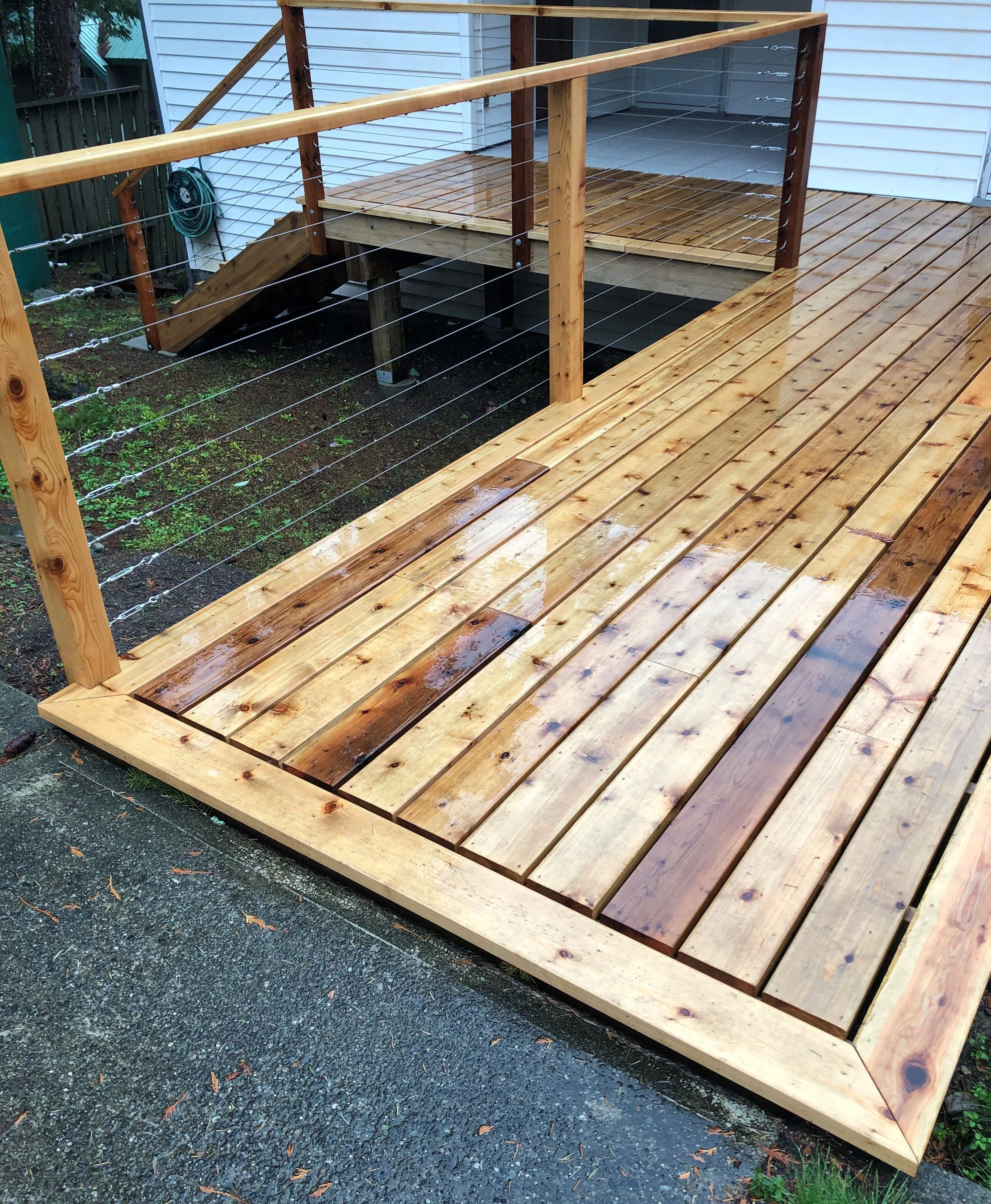 Cedar entrance deck with Stainless steel cable railing