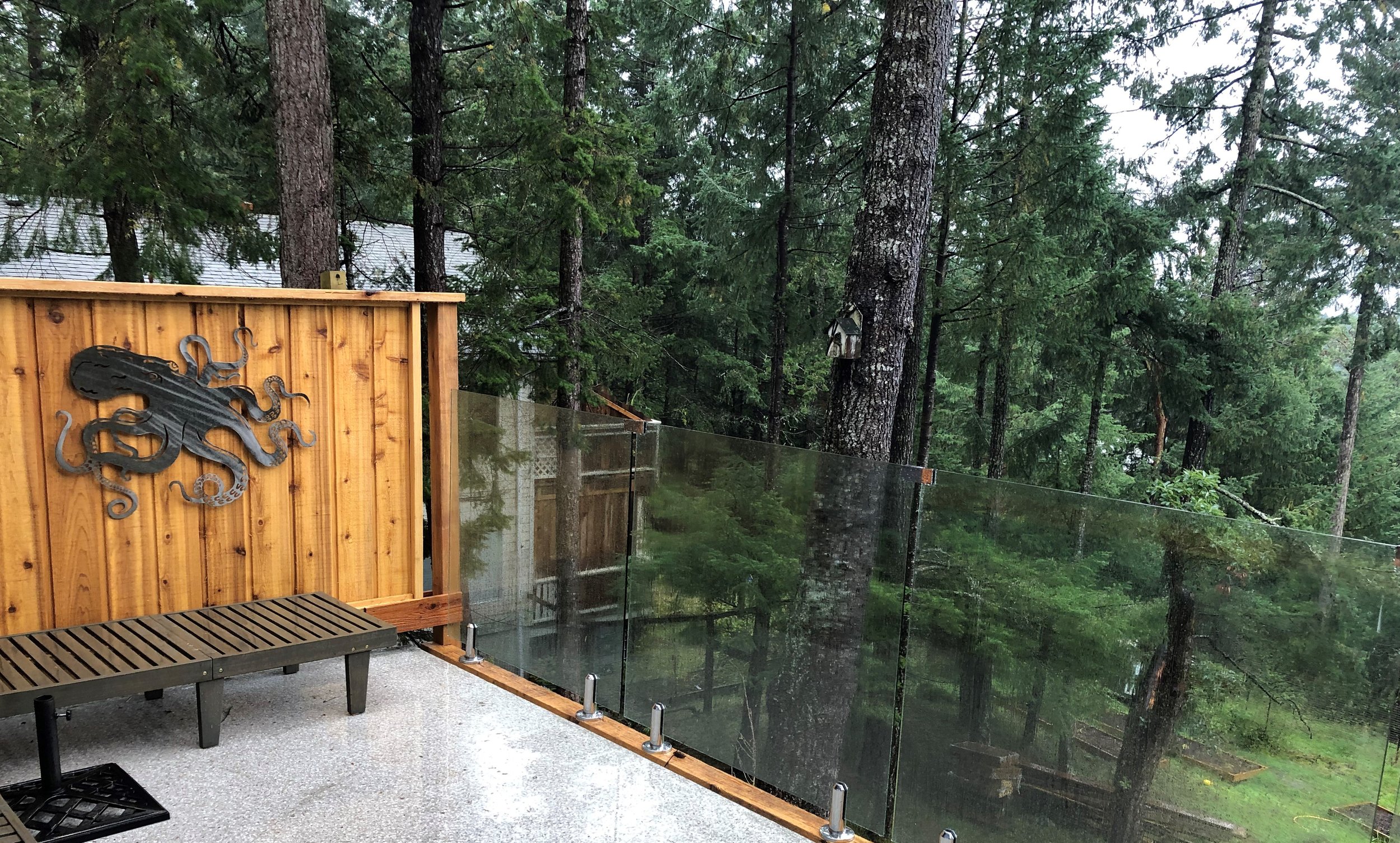 Infinity glass to cedar privacy railing transition