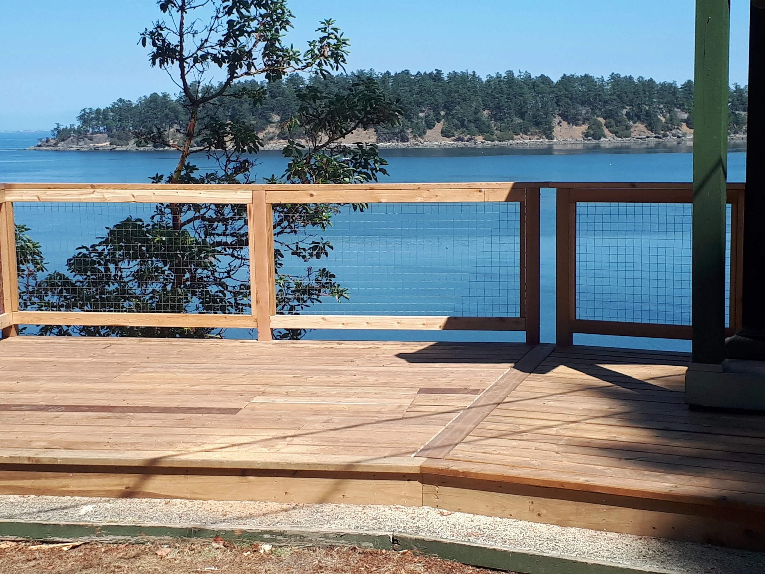 pressure treated side deck with mesh railing