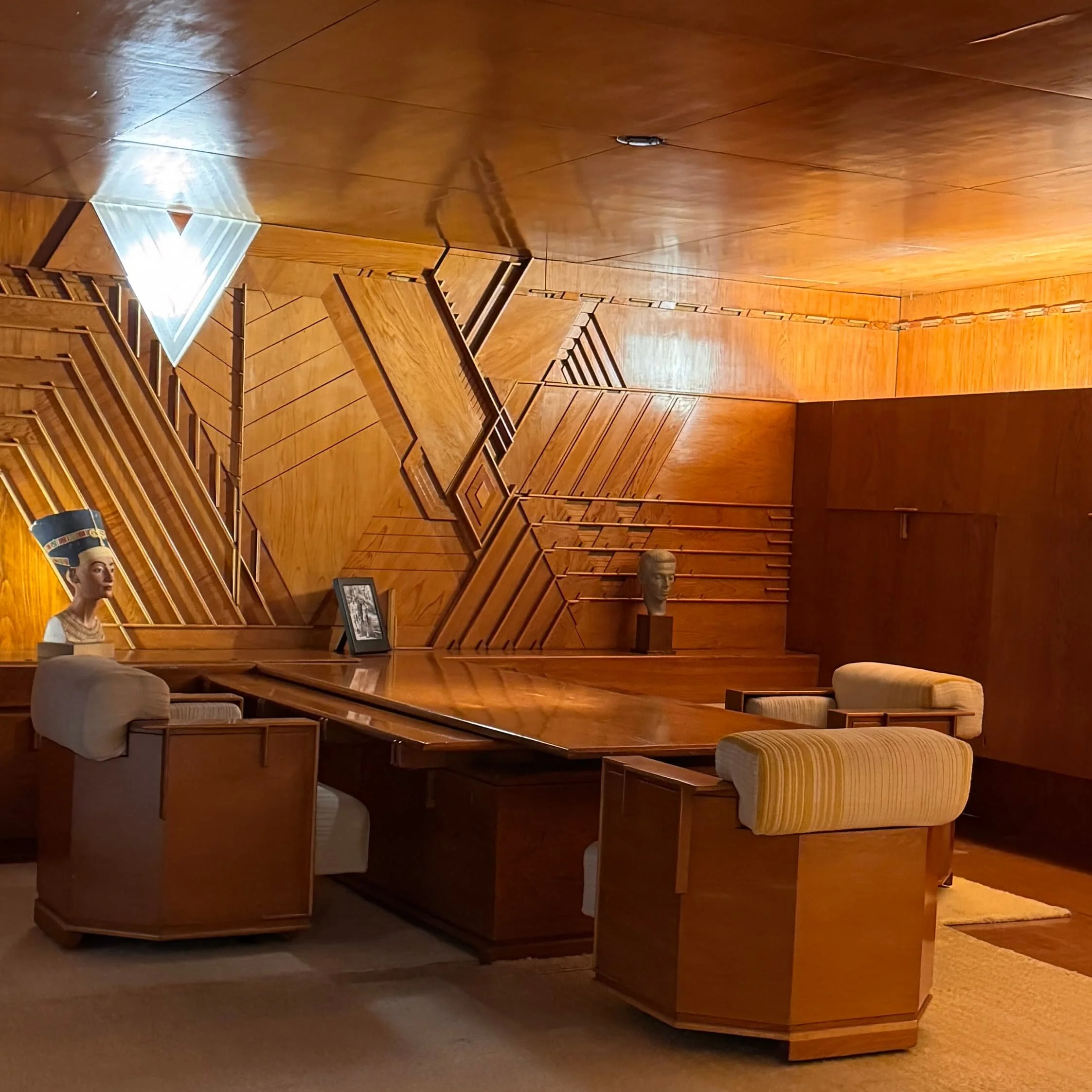 a beautiful office with walls and ceilings made of swamp cypress plywood