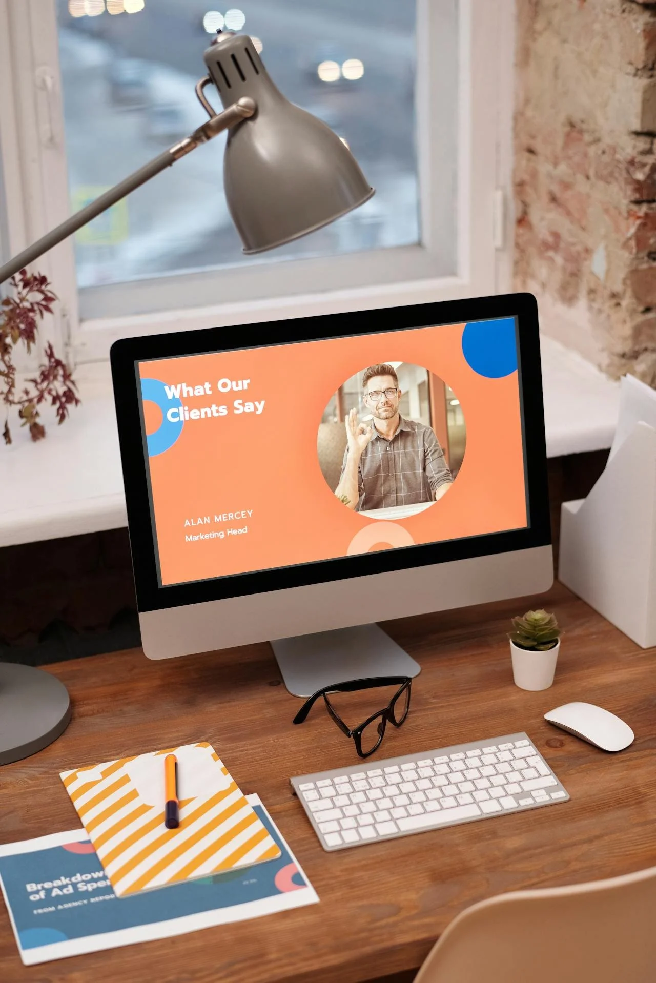 A computer on a desk showcasing a website being audited, a notebook and pen.