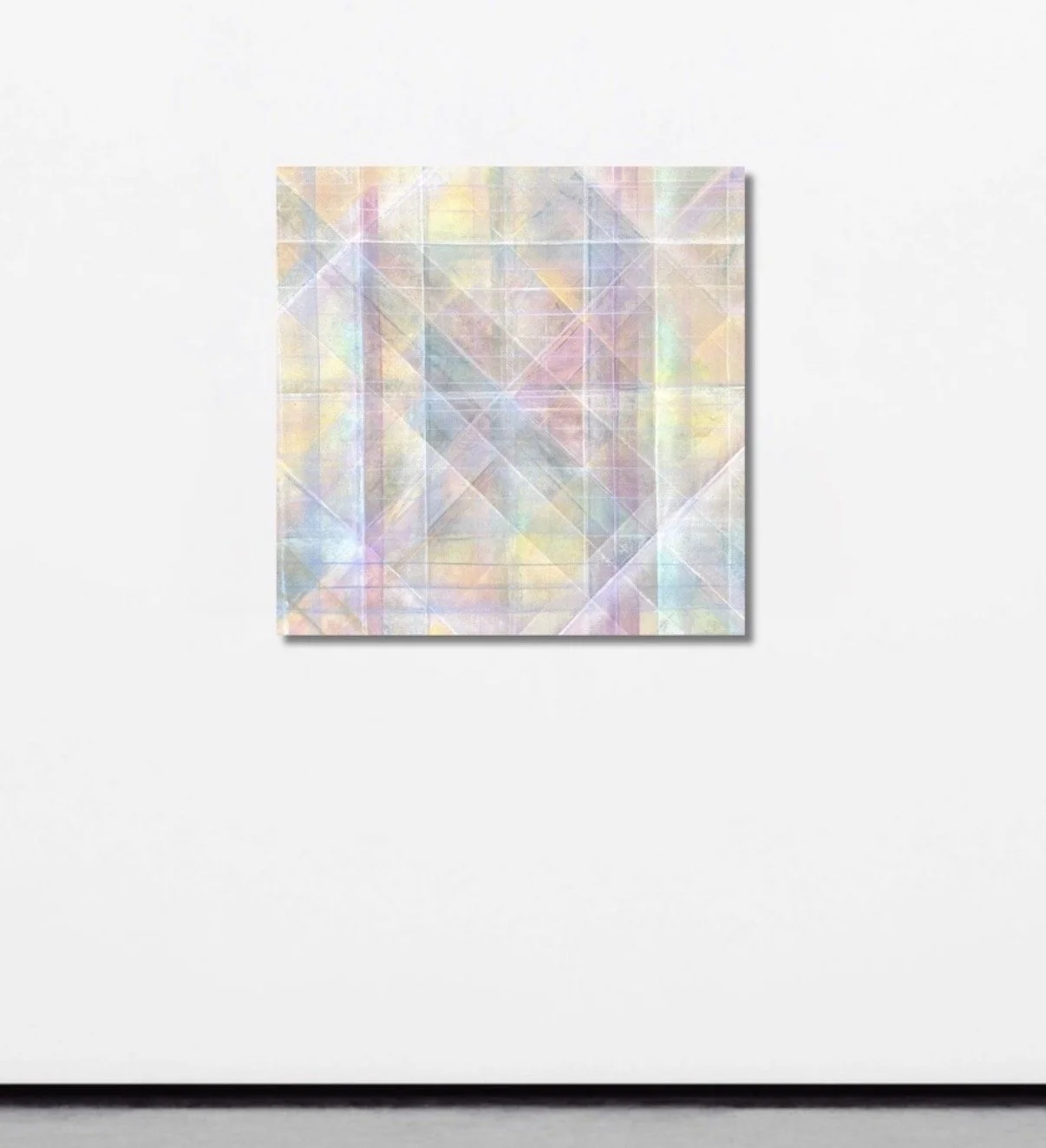 Abstract artwork featuring a grid of pastel-colored, iridescent, geometric shapes on a neutral background.