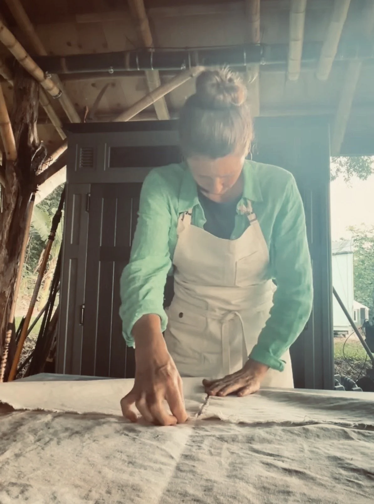 In the studio with Sarah Hessinger. Her signnature technique of folding canvas and creating abstract paintings. Her she preps the canvas to be painted on.