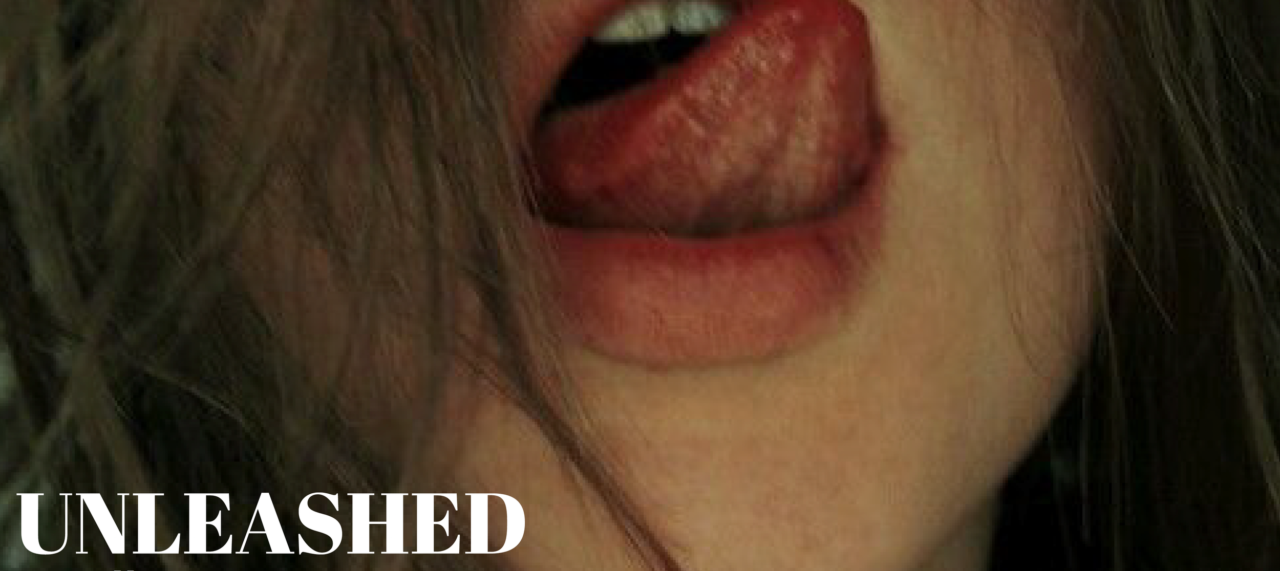Close-up of a woman's mouth open, showing teeth and tongue, with brown hair partially covering her face.