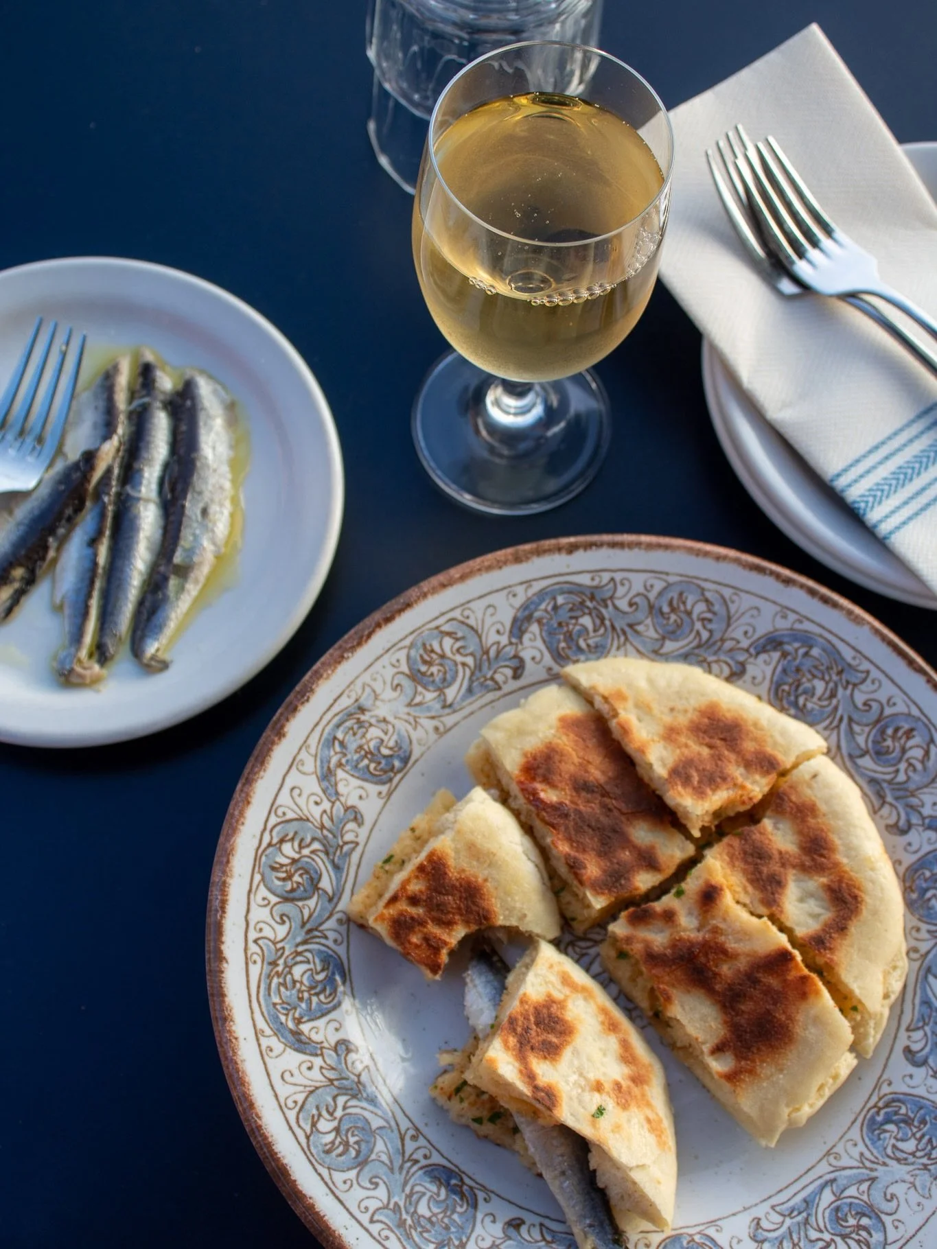 with the expansion, chef melissa added some new items to our full-time menu! bolo do caco &mdash; a traditional madeiran flatbread made with sweet potato. we slather it with fresno chili butter and totally recommend adding the boquerones 🤌
