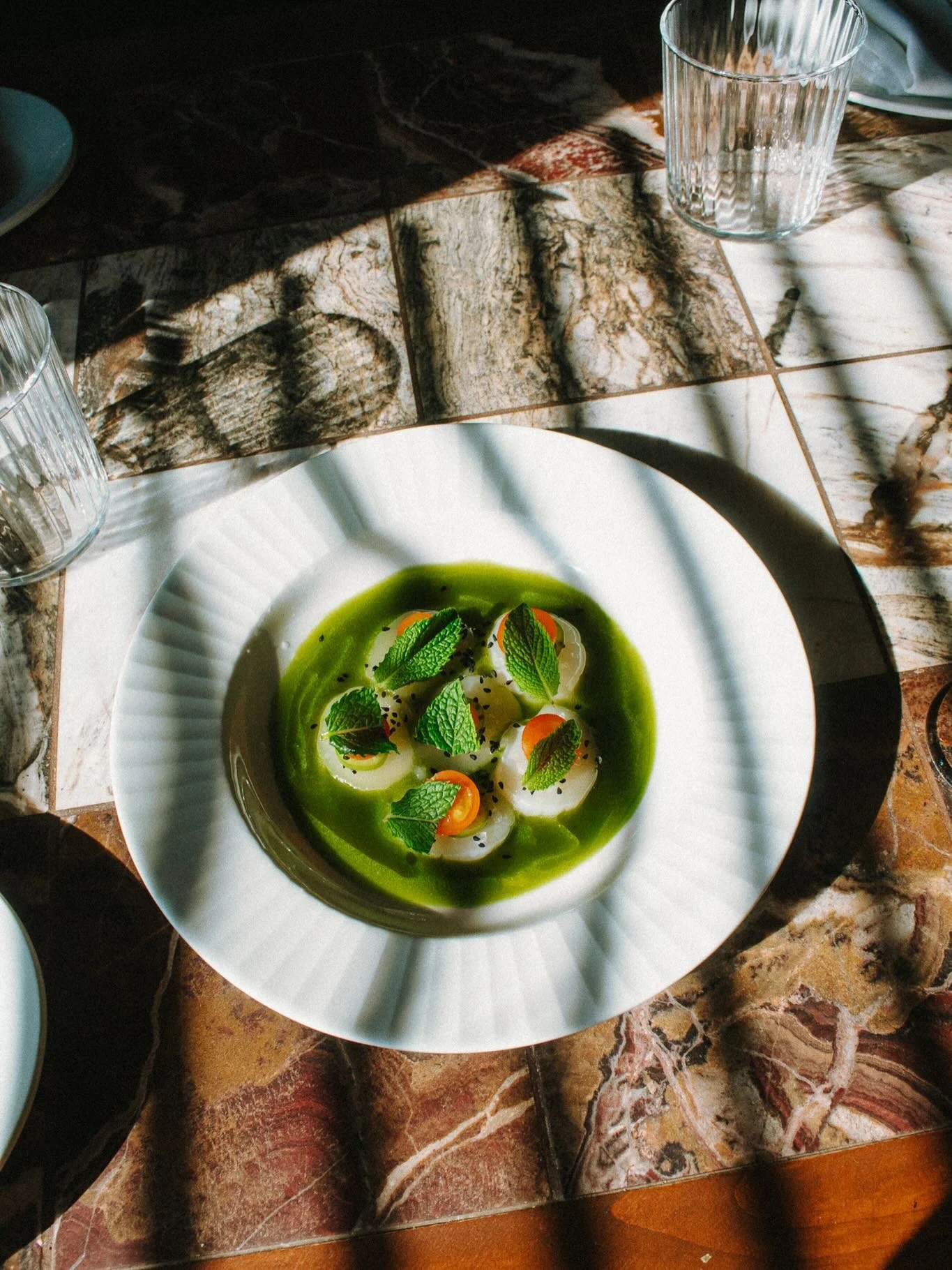 Our new Hokkaido Scallop Aguachile&mdash; Weiser family farms melons, serrano, sungold tomatoes, mint, and nigella seeds. Sweet, spicy, tangy, savory deliciousness