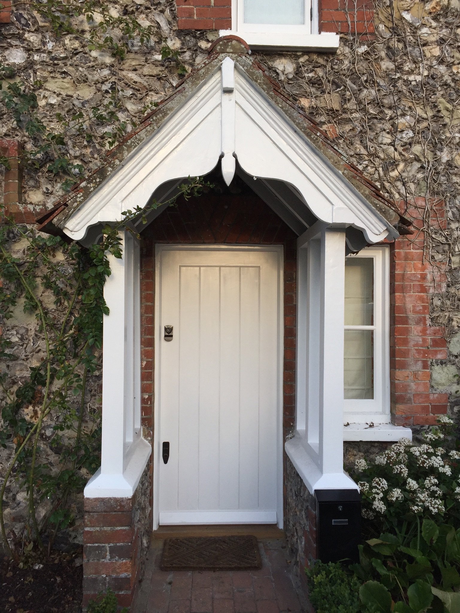 Painted white Accoya T&G front door