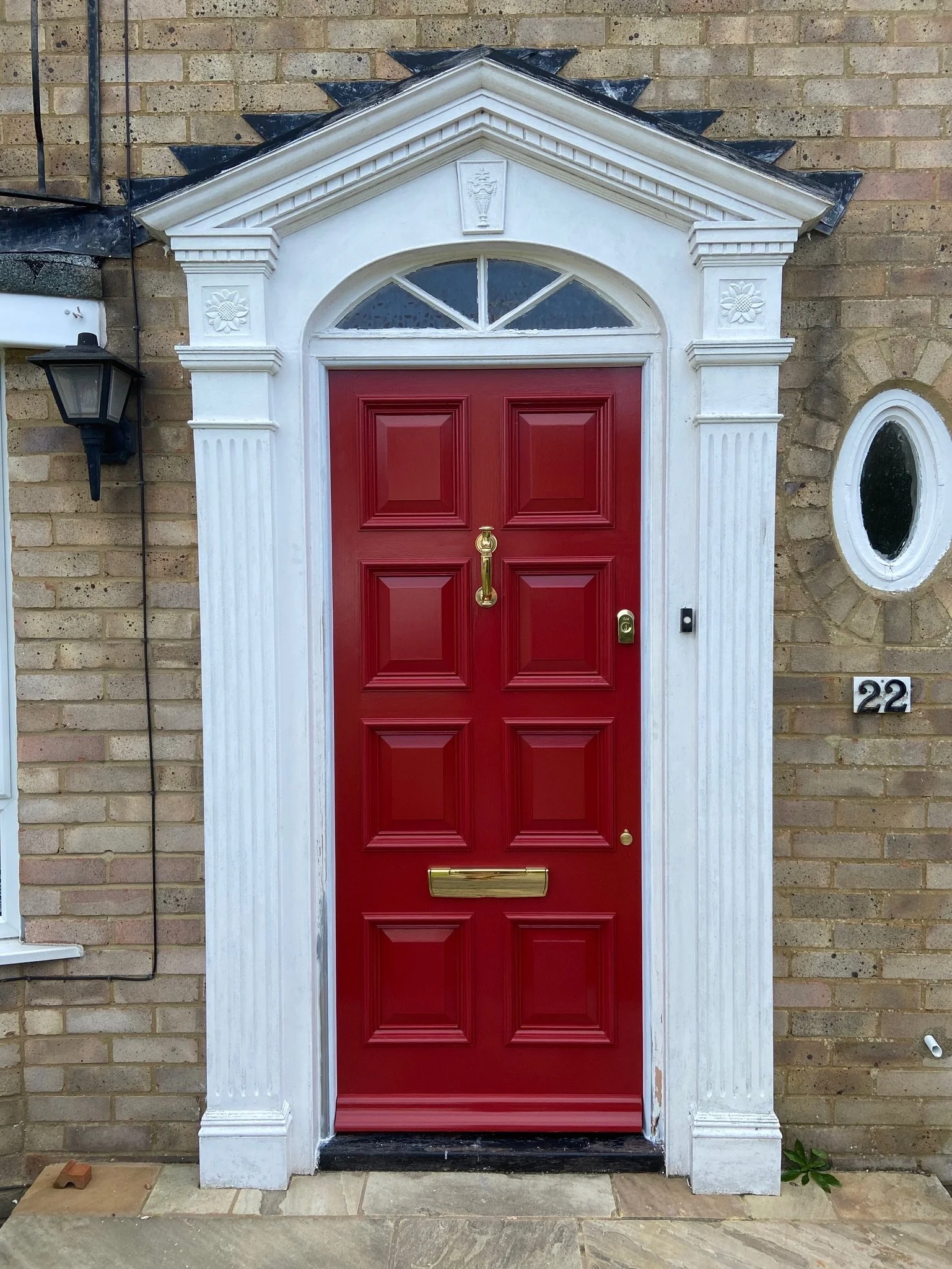 Painted red 8-panel pine front door
