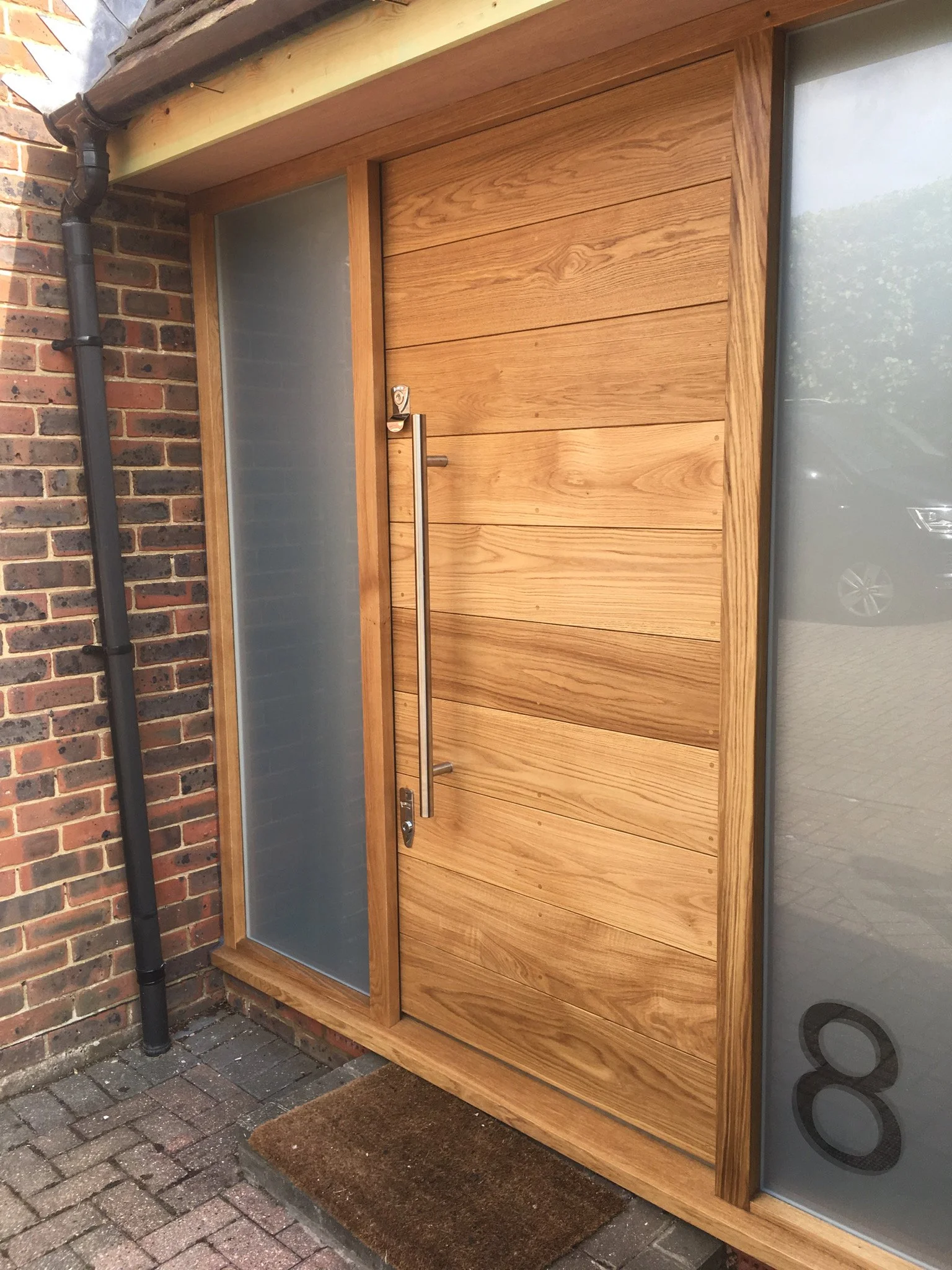 Contemporary oak front door and sidelights