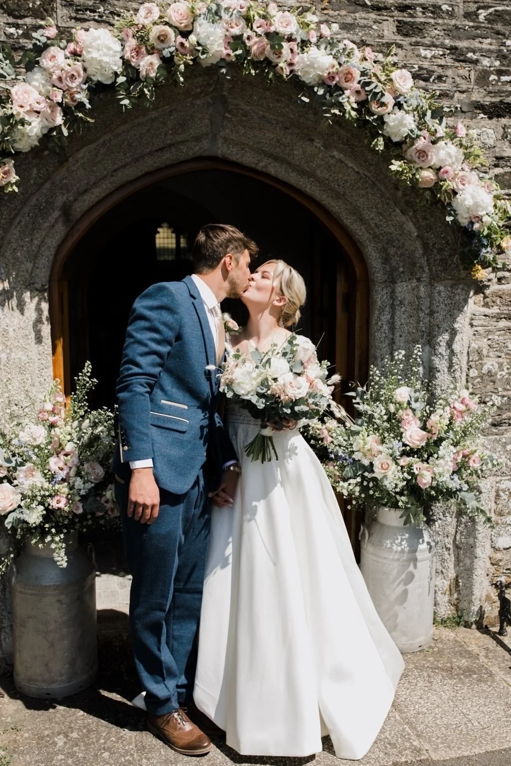 pretty pink floral wedding arch