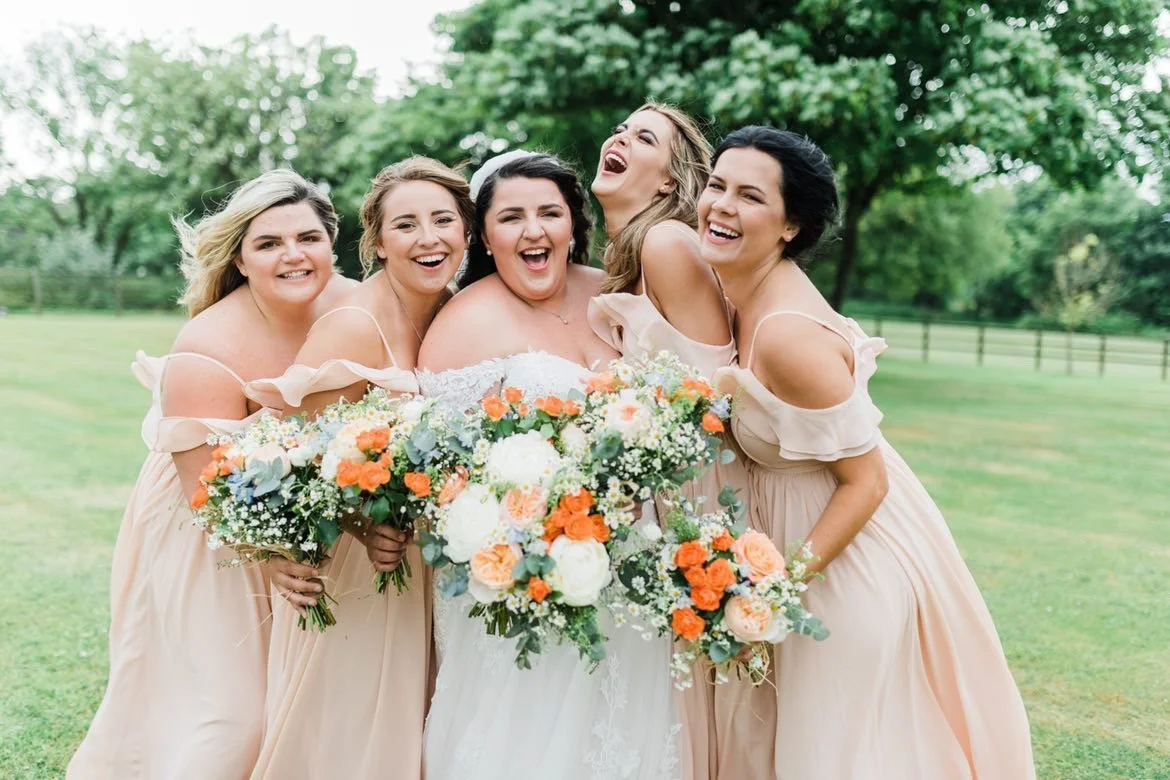 peach and orange bridesmaids bouquets