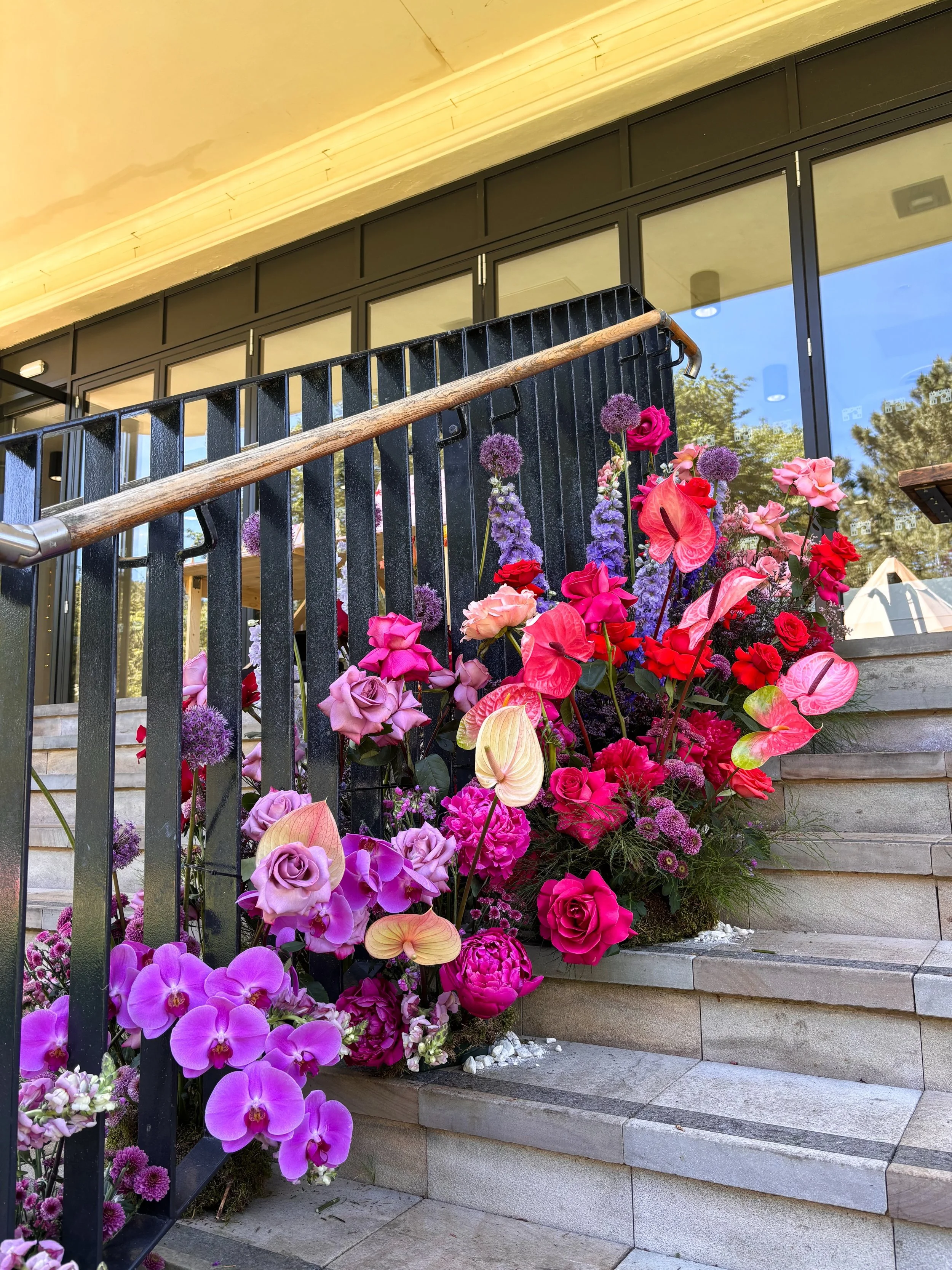 A colourful garden party at Calderstones for Jess &amp; Alex 💒☀️

A disco tree ceremony backdrop (featuring fresh flower garlands) &amp; bold stair florals set the tone for their FUN outdoor wedding 🌈

Always a fab day @thereaderorg the staff are s