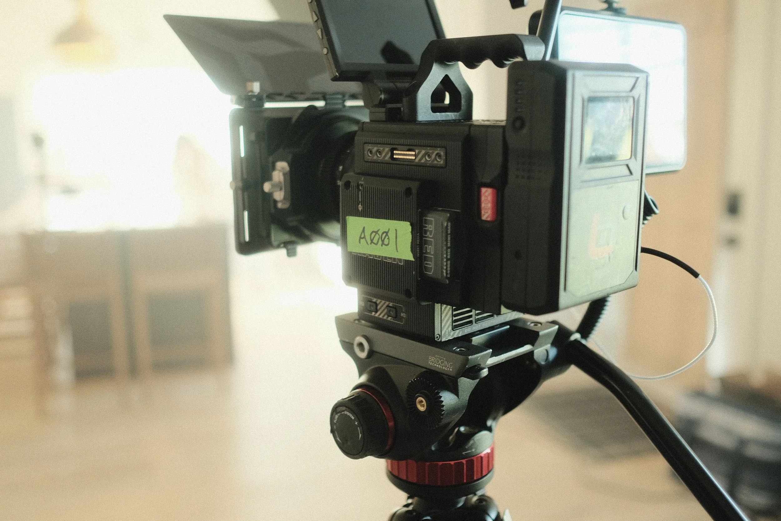 Close up image of a RED digital cinema camera labeled A001.