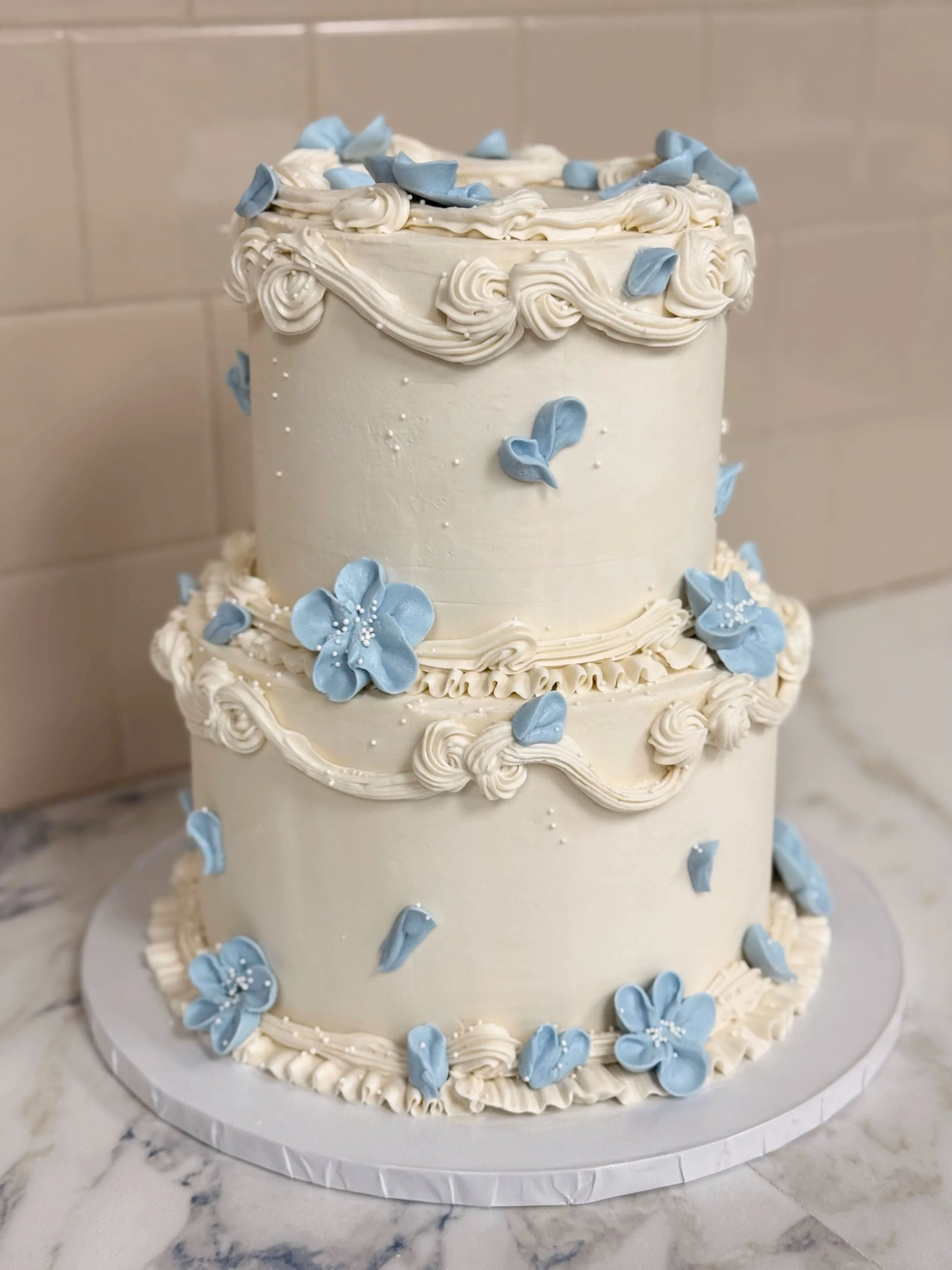A beautiful cake by our head baker, Kayla, went out the door to a very special bride this weekend! Did you know you can order custom cakes from us for all of your special events? Weddings, graduations, birthdays &amp; more - reach out today to order 