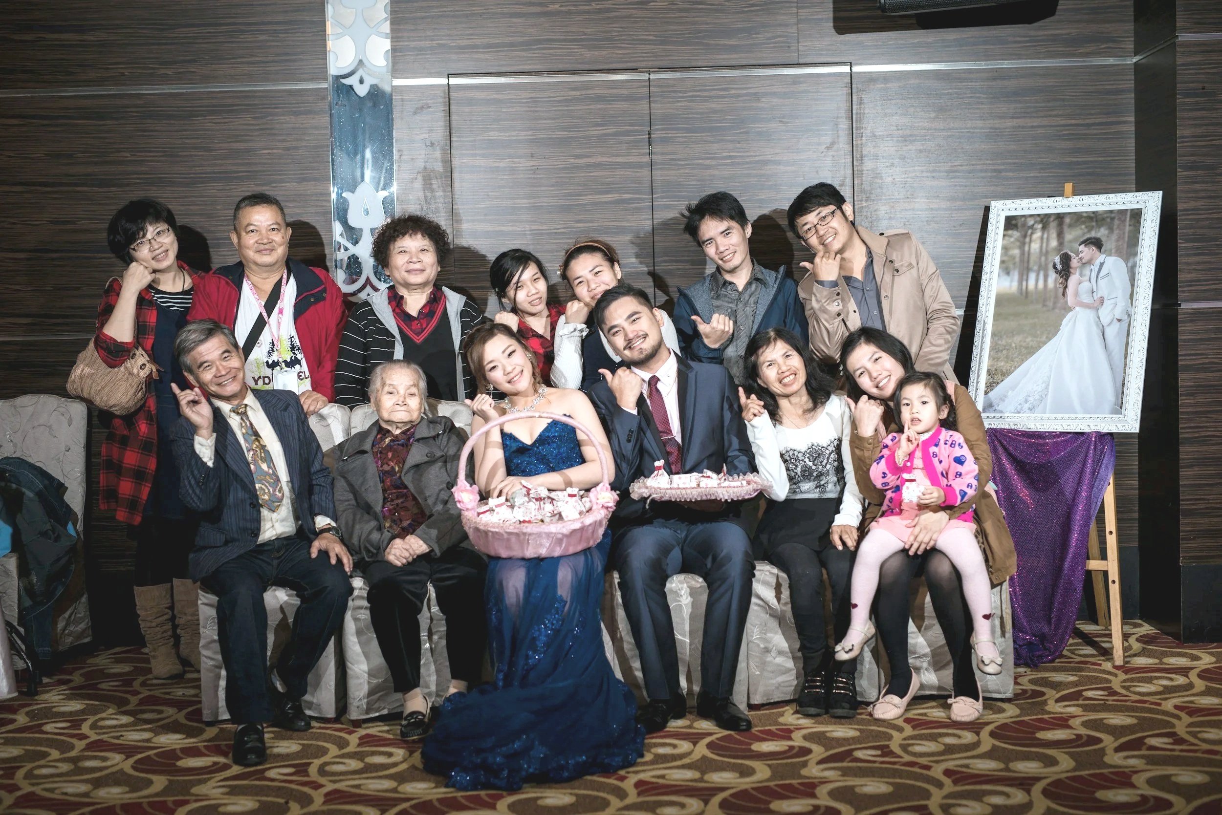 Multi-generational family photo at a young couple's wedding