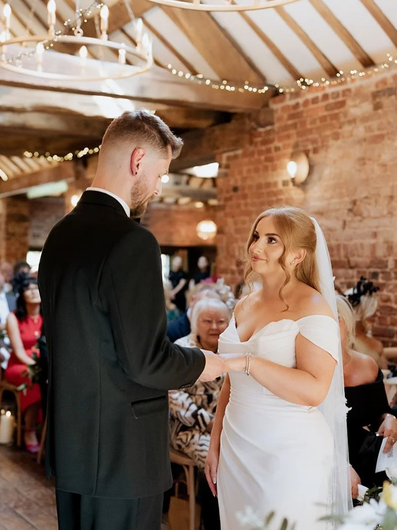 A ceremony filled with warm light, soft vows and the kind of tenderness you feel before you even notice it.

The Coach House at Soughton Hall looked beautiful, but they were the moment.

Quiet glances, steady hands, and a room full of love.
The kind 