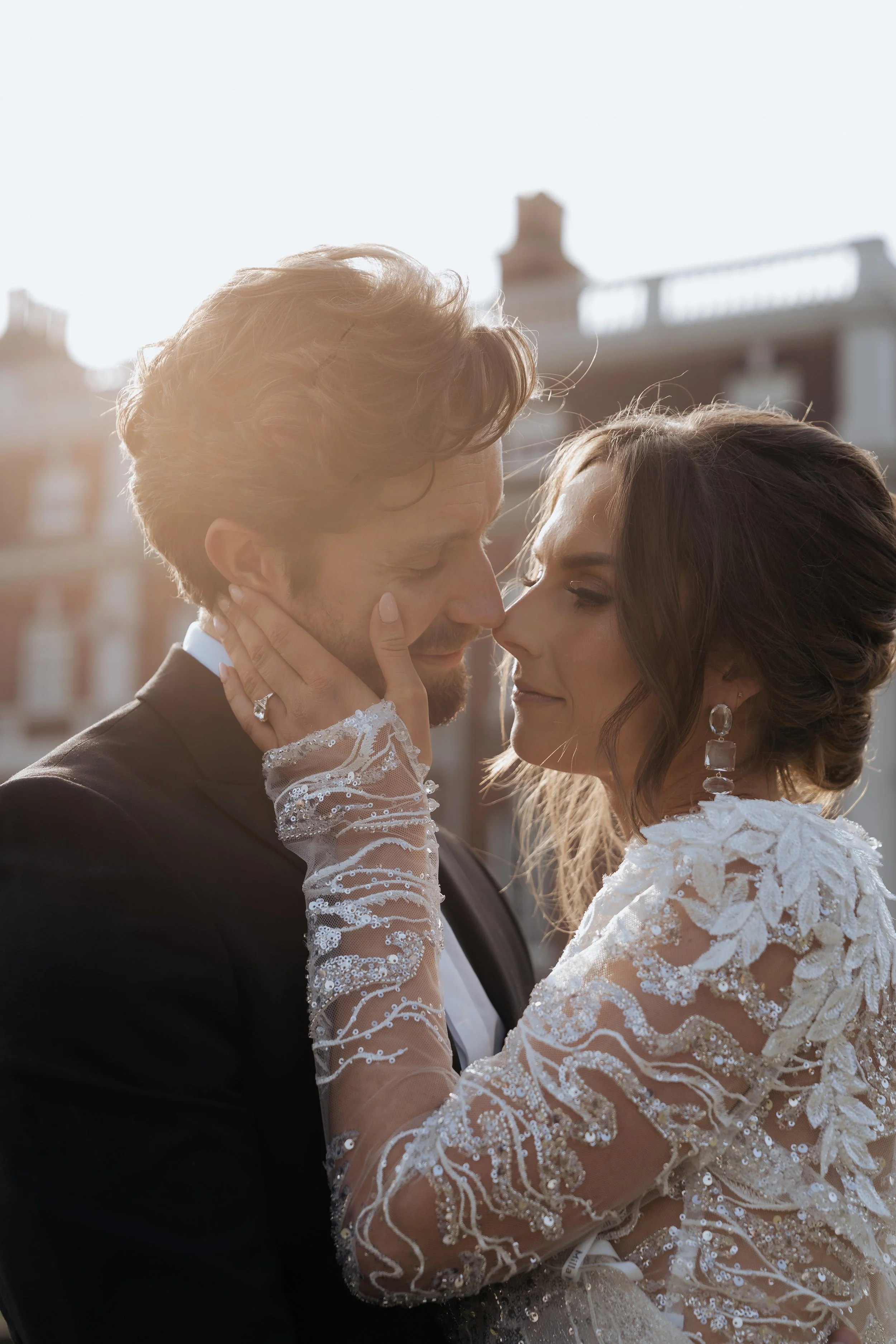 An intimate moment between newlyweds captured in soft evening light, photographed with a calm, editorial approach that prioritises connection and emotion.