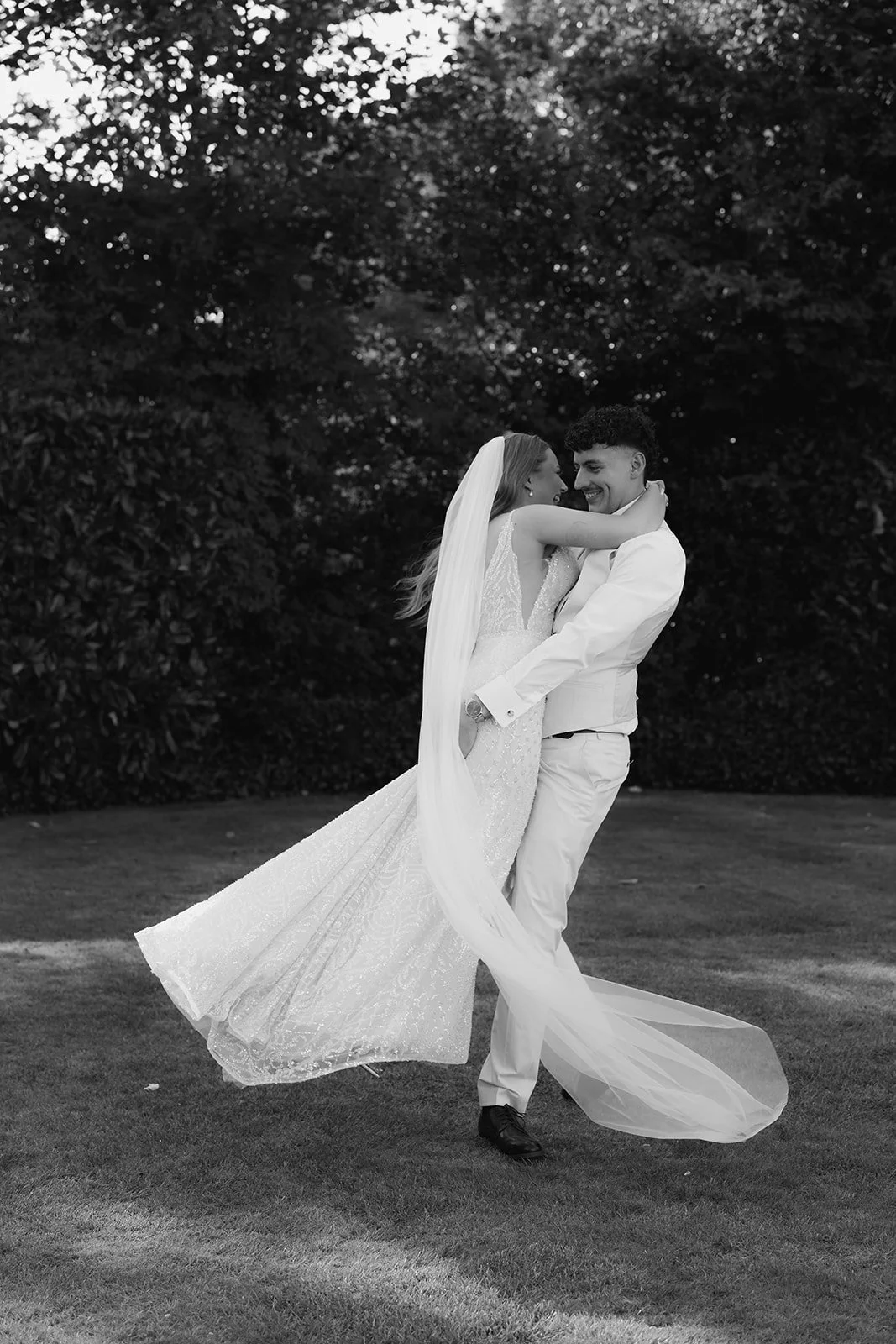 Natural documentary wedding photography capturing an intimate, joyful moment between a newly married couple