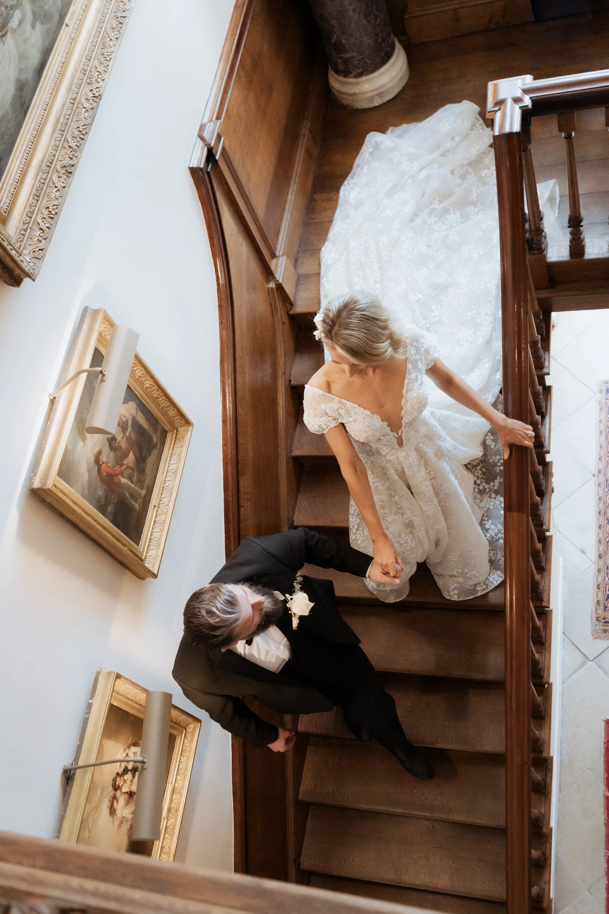 editorial wedding photograph of a couple on the staircase inside Iscoyd Park