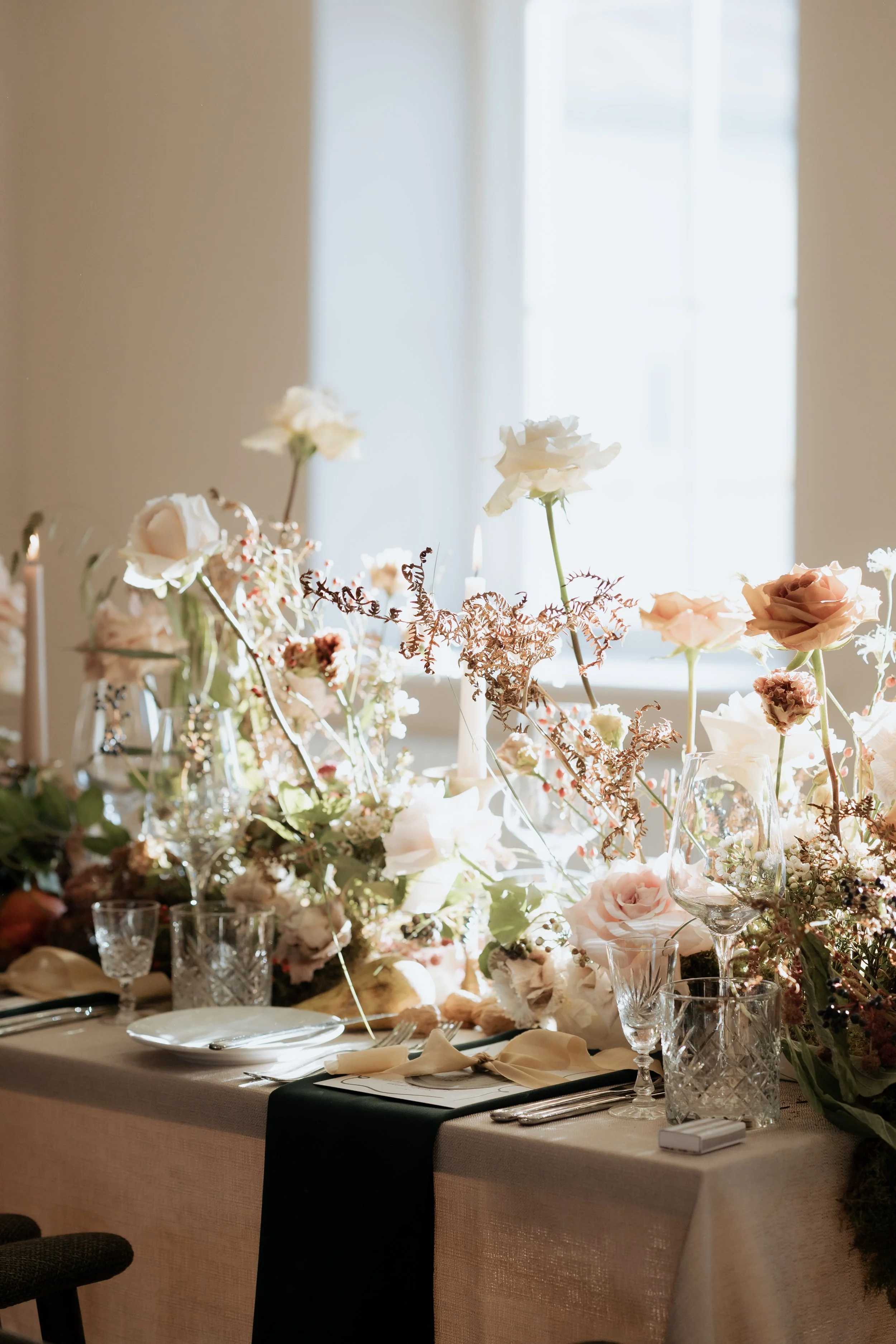 Editorial wedding table styling with soft florals and candlelight, reflecting a considered photography process suited to luxury venues such as Middleton Lodge.