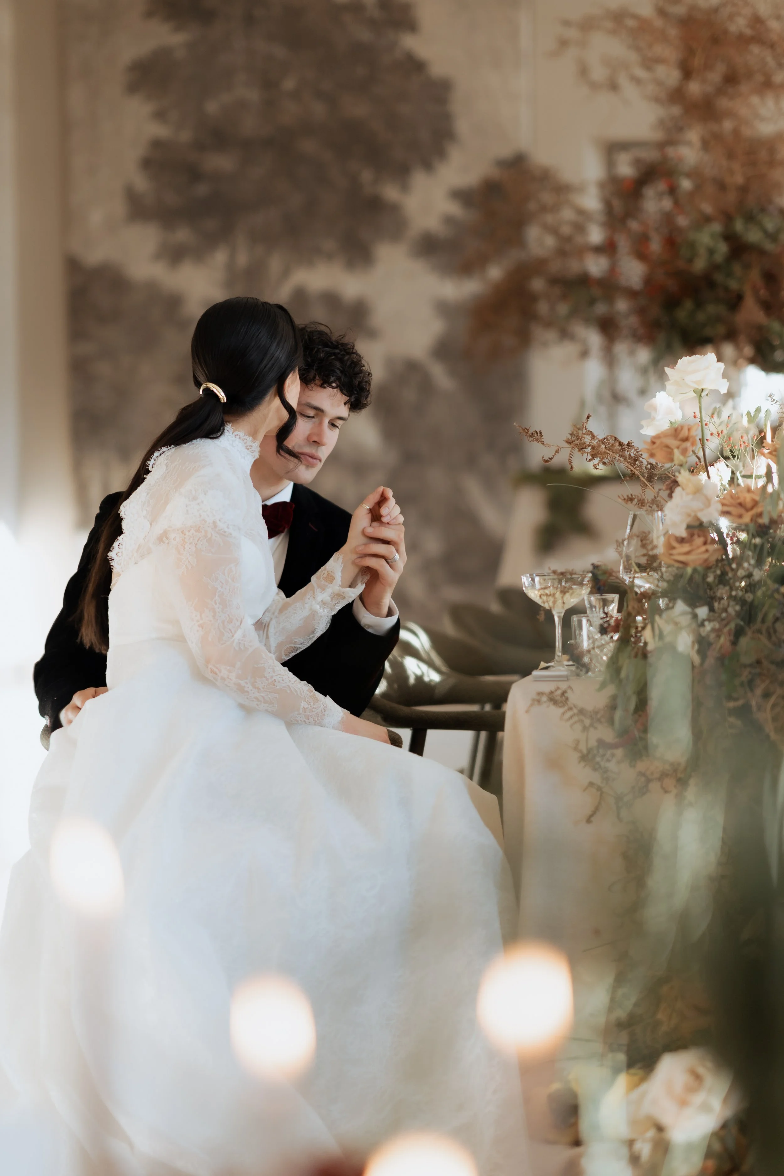 Editorial-style wedding photography capturing an intimate, candlelit moment between a couple, reflecting the romantic atmosphere of a Garthmyl Hall–inspired celebration.