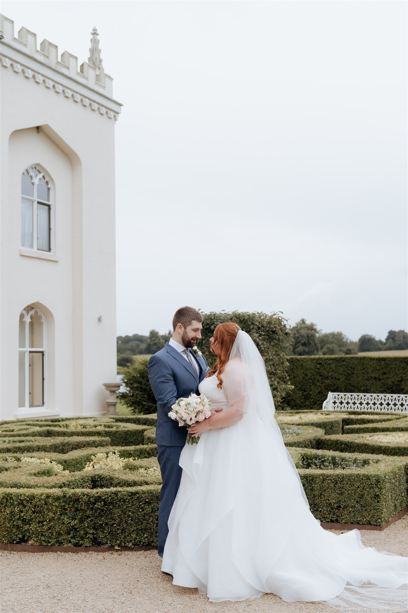 Bride and groom portraits at Combermere Abbey in Cheshire with elegant editorial wedding styling and soft romantic photography.