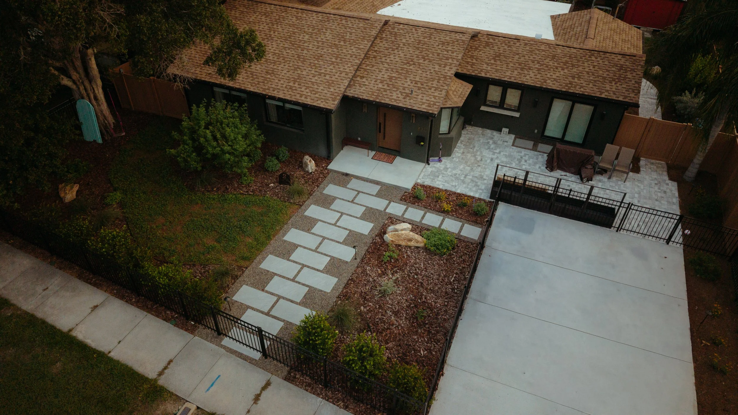 Top-down view of front yard garden design and installation with Florida native ground covers, pathways, raised planters, trellises, seating area in St. Pete, FL