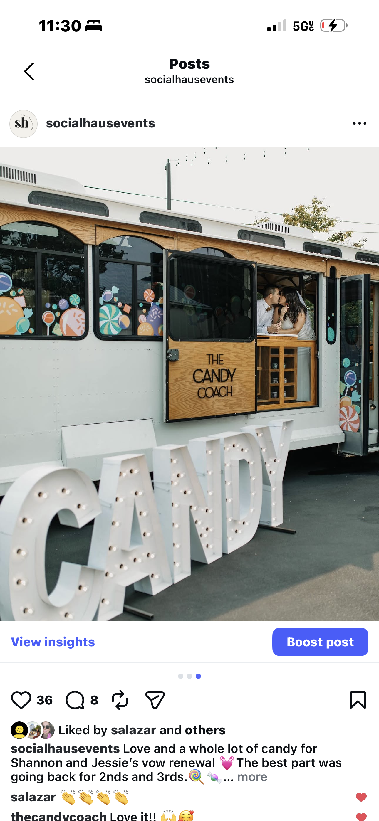 Image of a mobile candy or dessert truck named "The Candy Coach", with colorful candy-themed decorations on the windows and a large illuminated "CANDY" sign in front. There are two people sharing a kiss inside the truck.