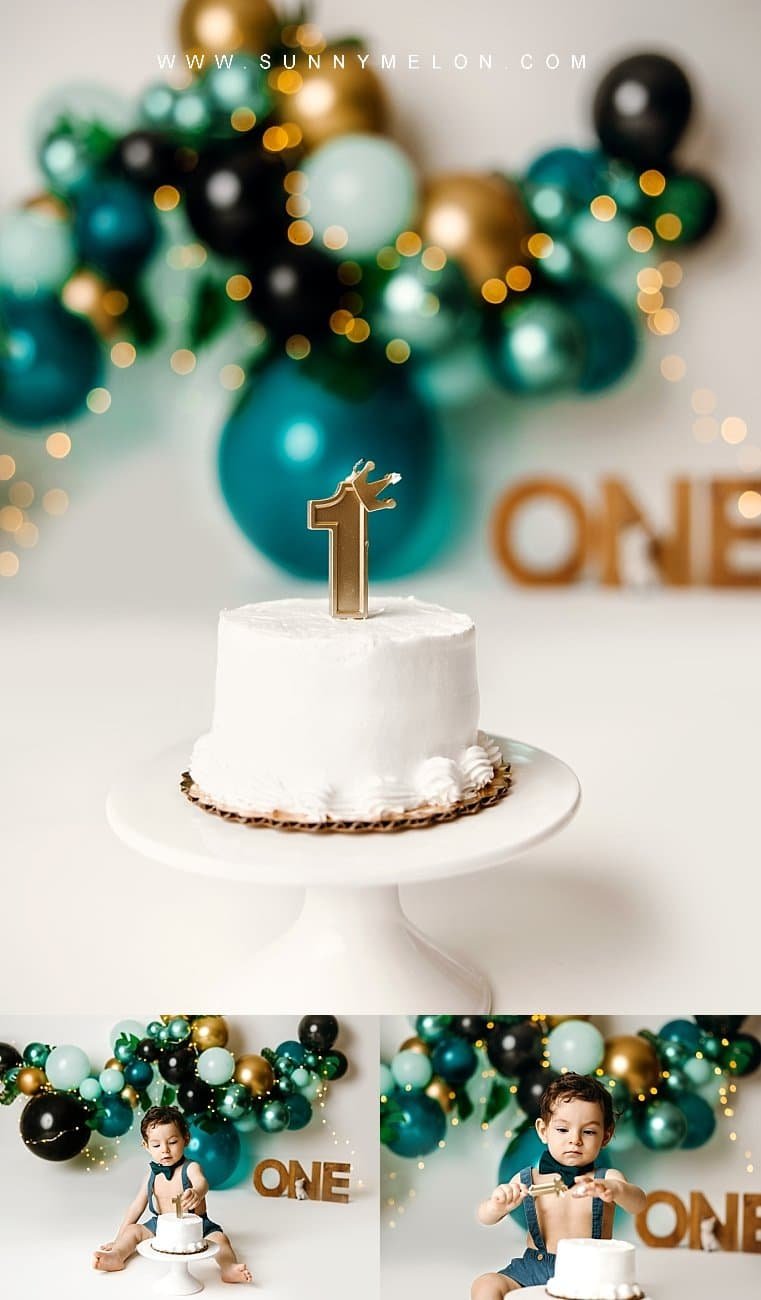 Simple cream layered cake with a gold "1" crown topper for a first birthday milestone session.