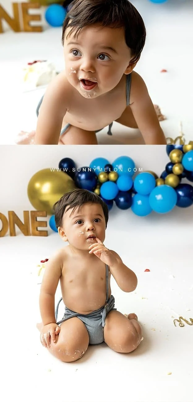 Toddler boy enjoying a blue and gold themed cake smash photography session in a professional studio.