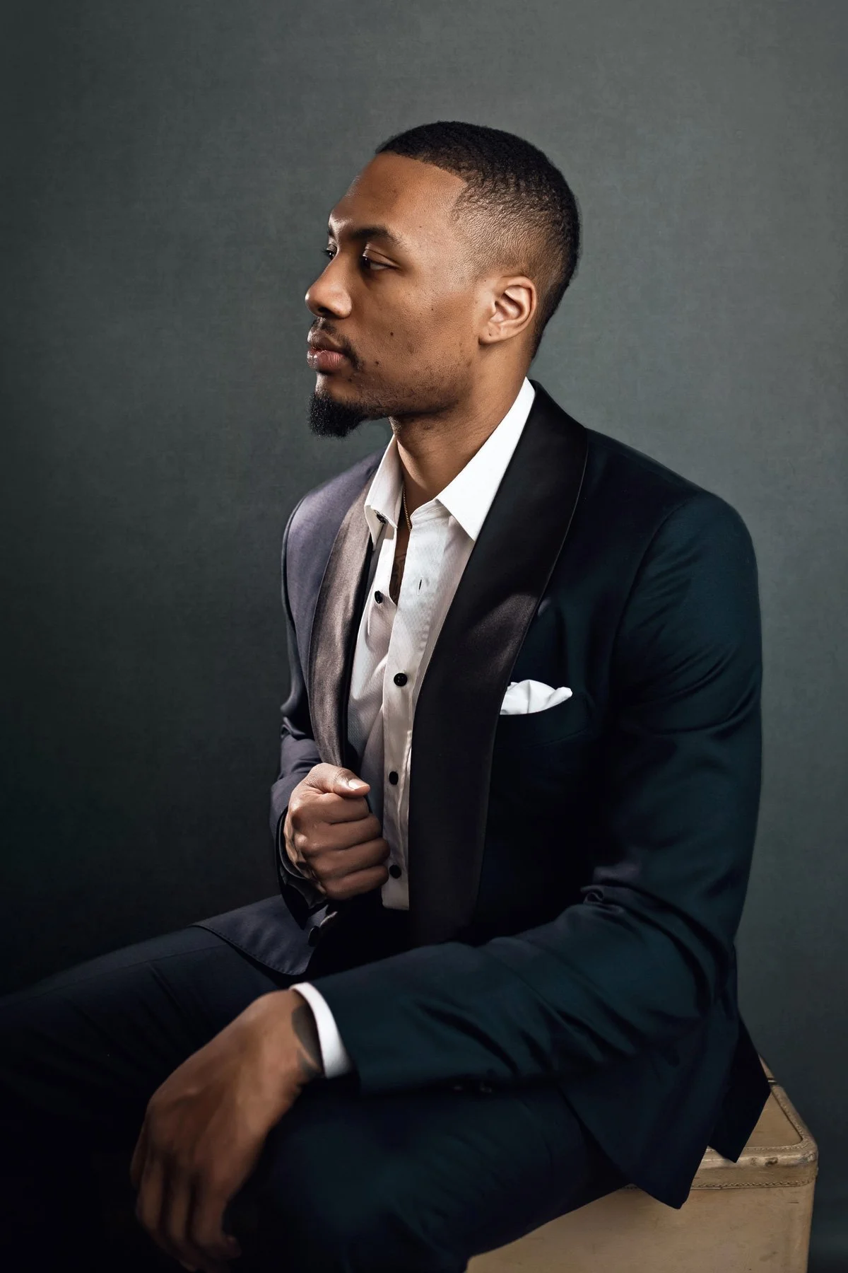 Professional studio portrait of Damian Lillard wearing a black tuxedo with satin lapels, captured by a Portland celebrity photographer.