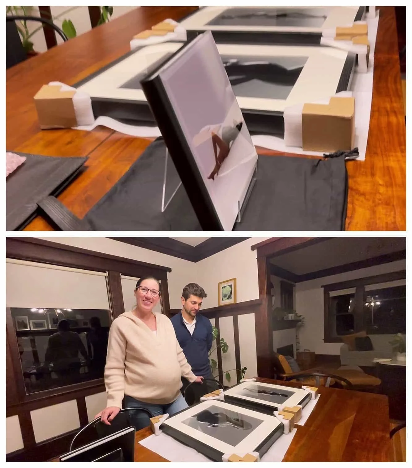 Happy maternity photography clients viewing their custom-framed fine-art gallery prints at home.