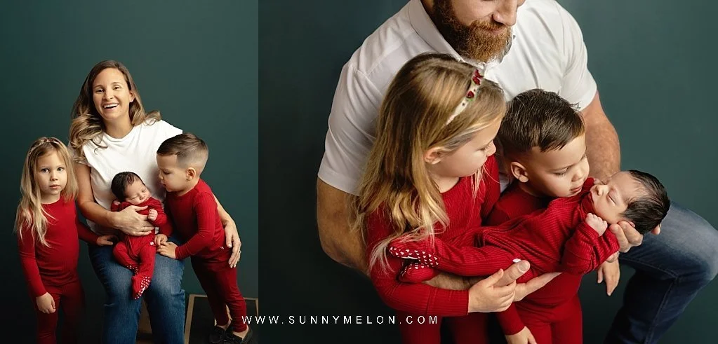 Mother, father, and siblings posing with newborn baby against a dark green studio backdrop.