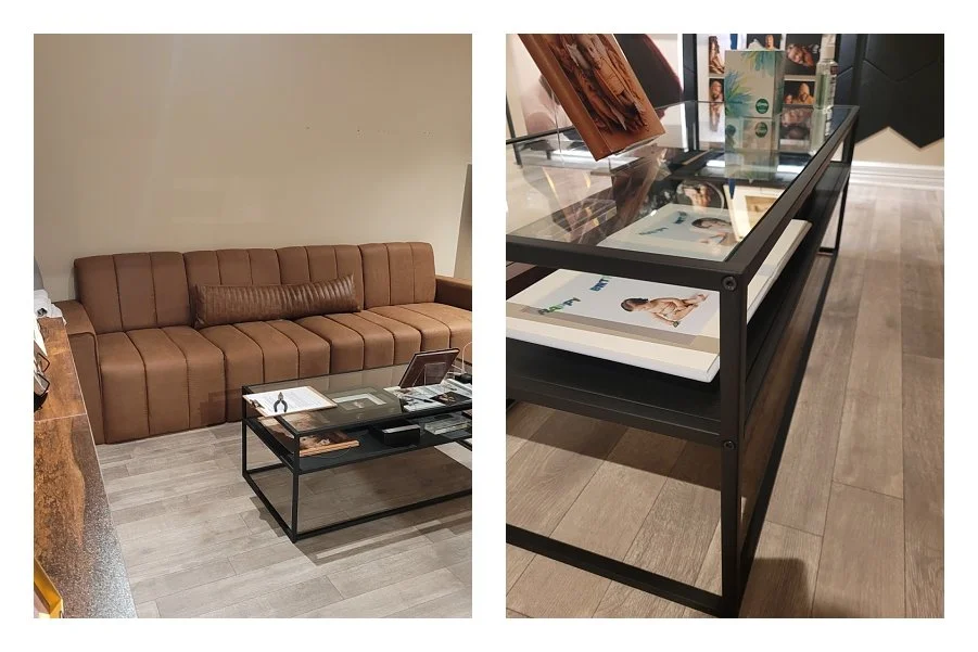 A two-image photography studio interior collage; the left shows a brown channel-tufted sofa with a glass-top coffee table, and the right shows a black metal display table containing framed portrait samples.
