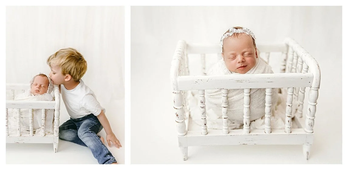 A two-image studio newborn collage against a white background; the left shows a young boy kissing his sleeping sibling in a white vintage crib prop, and the right features a close-up of the swaddled newborn smiling.