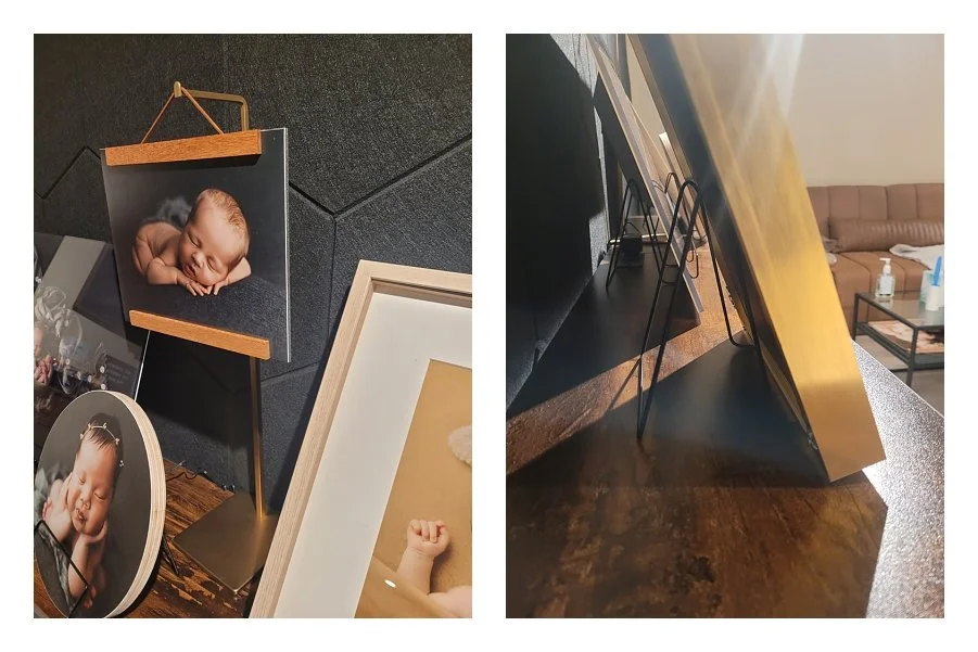 A two-image photography studio product collage; the left shows a close-up of a newborn portrait on a brass hanging easel alongside a round wood block print, and the right shows a side profile view of metal wire display stands holding framed artwork.