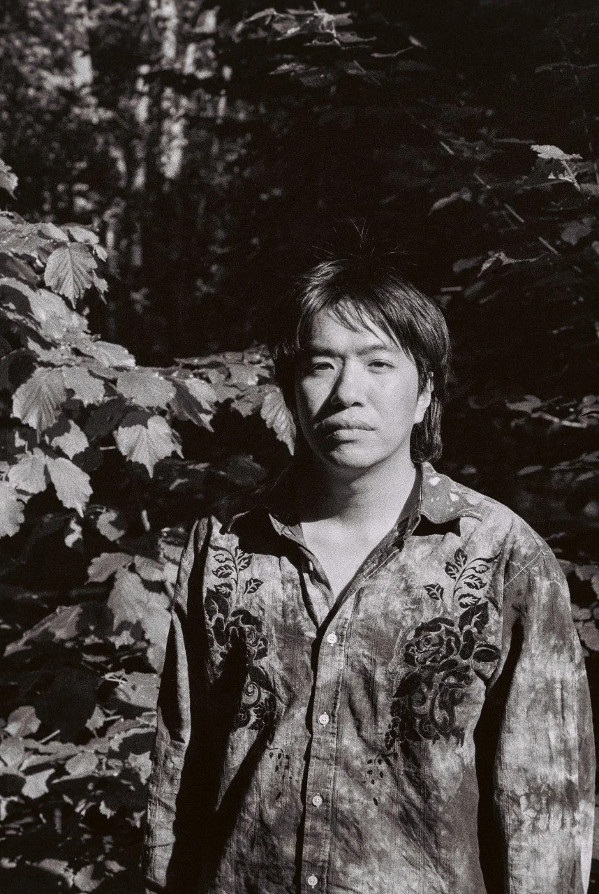 This is a black and white photograph of Nanut Thanapornrapee.