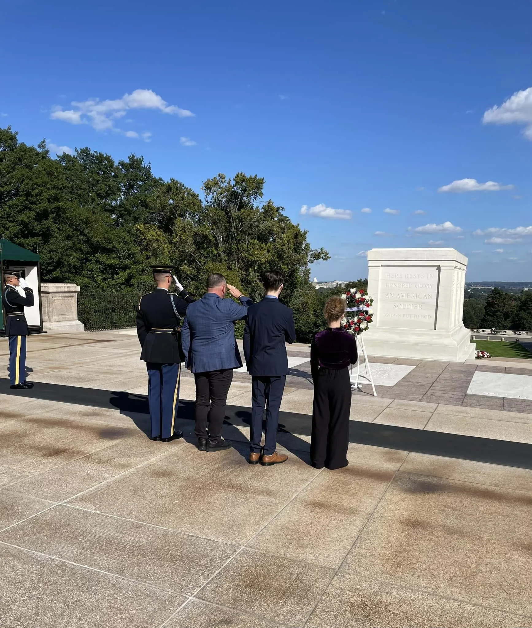 Levi Rodgers at Arlington National Cemetery with the children of SSG Joshua M. Mills and SFC Bradley S. Bohle, laying a wreath at the Tomb of the Unknown Soldier