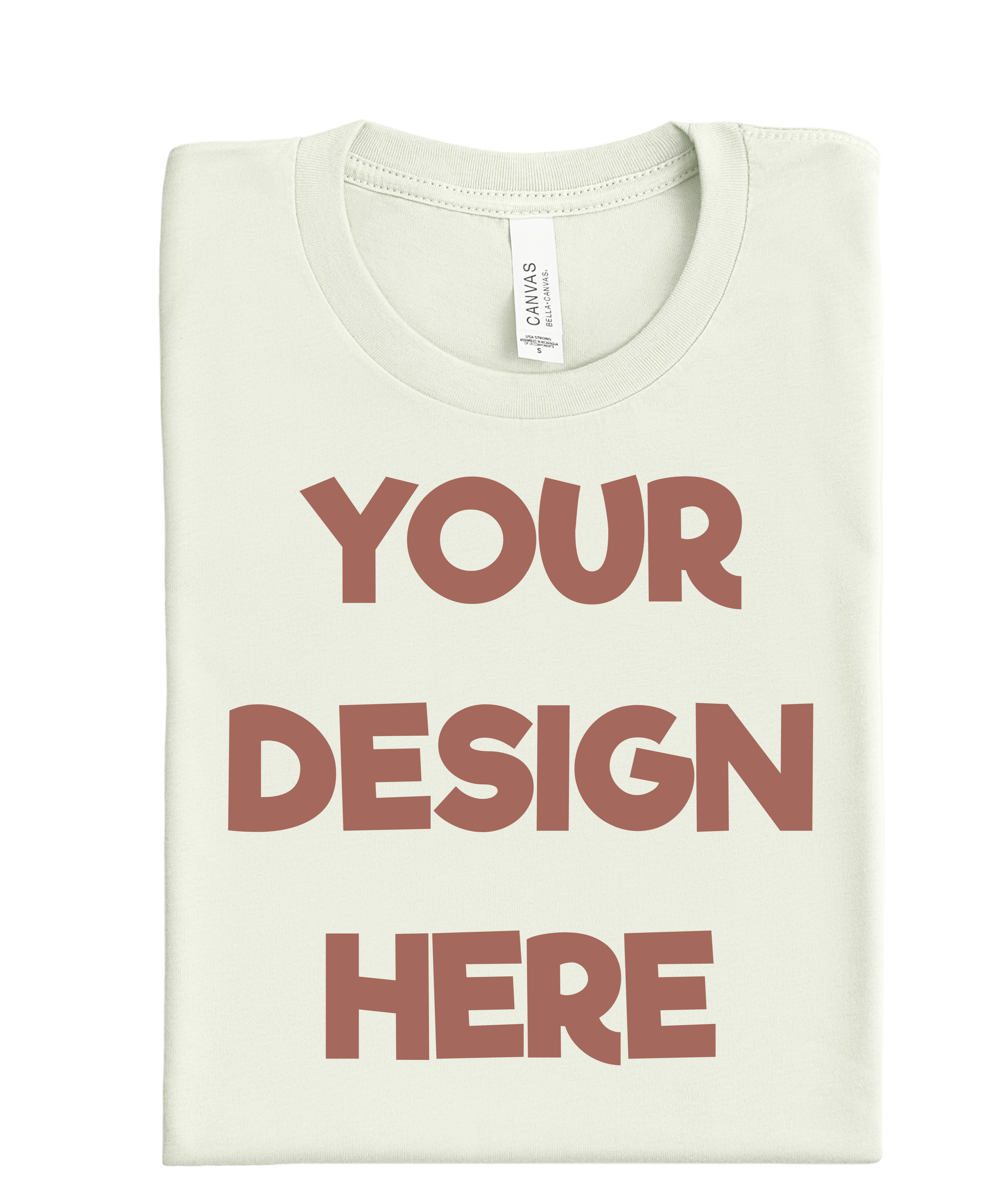 A folded light-colored T-shirt with the words "YOUR DESIGN HERE" printed on it in large, brown, uppercase letters.