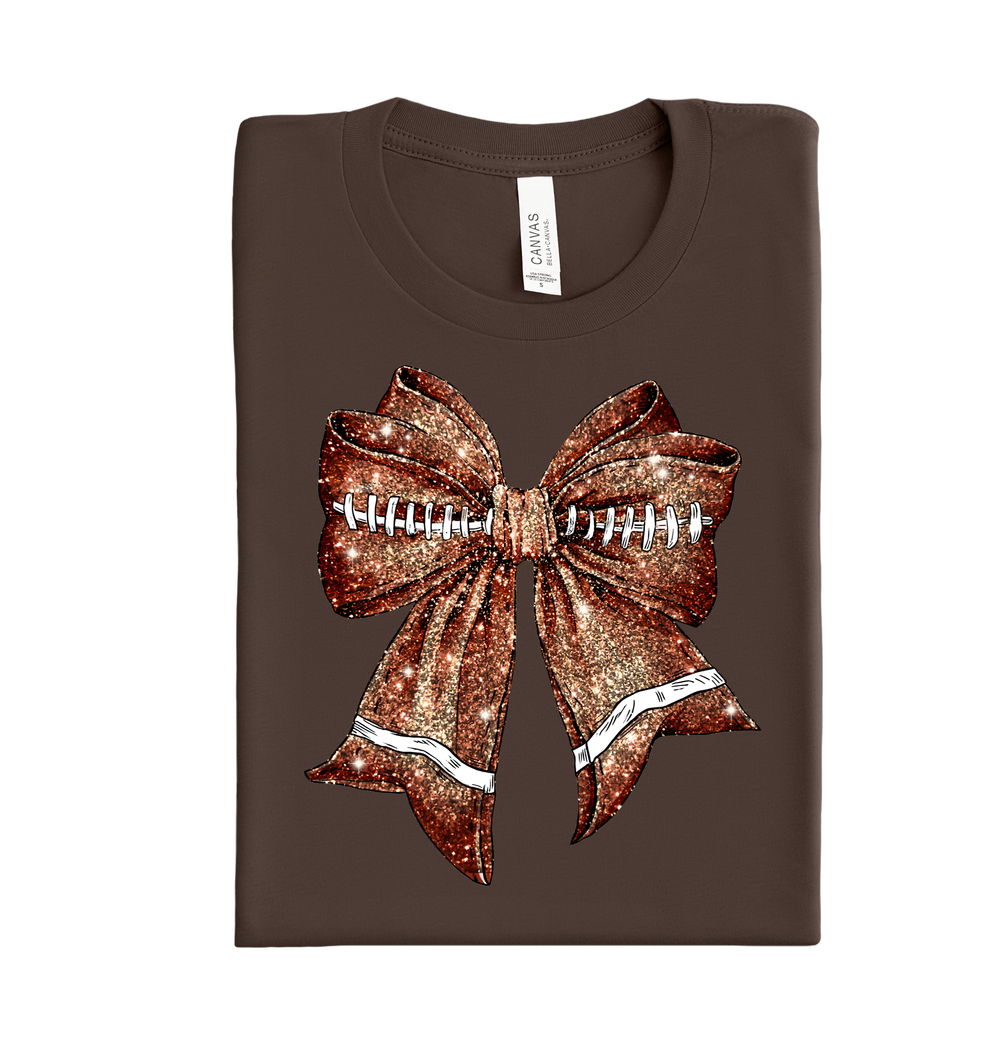 Sparkly bow with football design DTF transfer for game day shirts