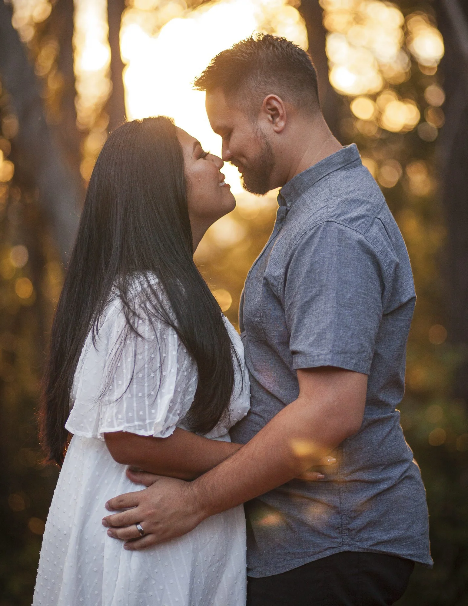 Engaged couples happily engaged in Hawaii at Aiea Loop Trail.