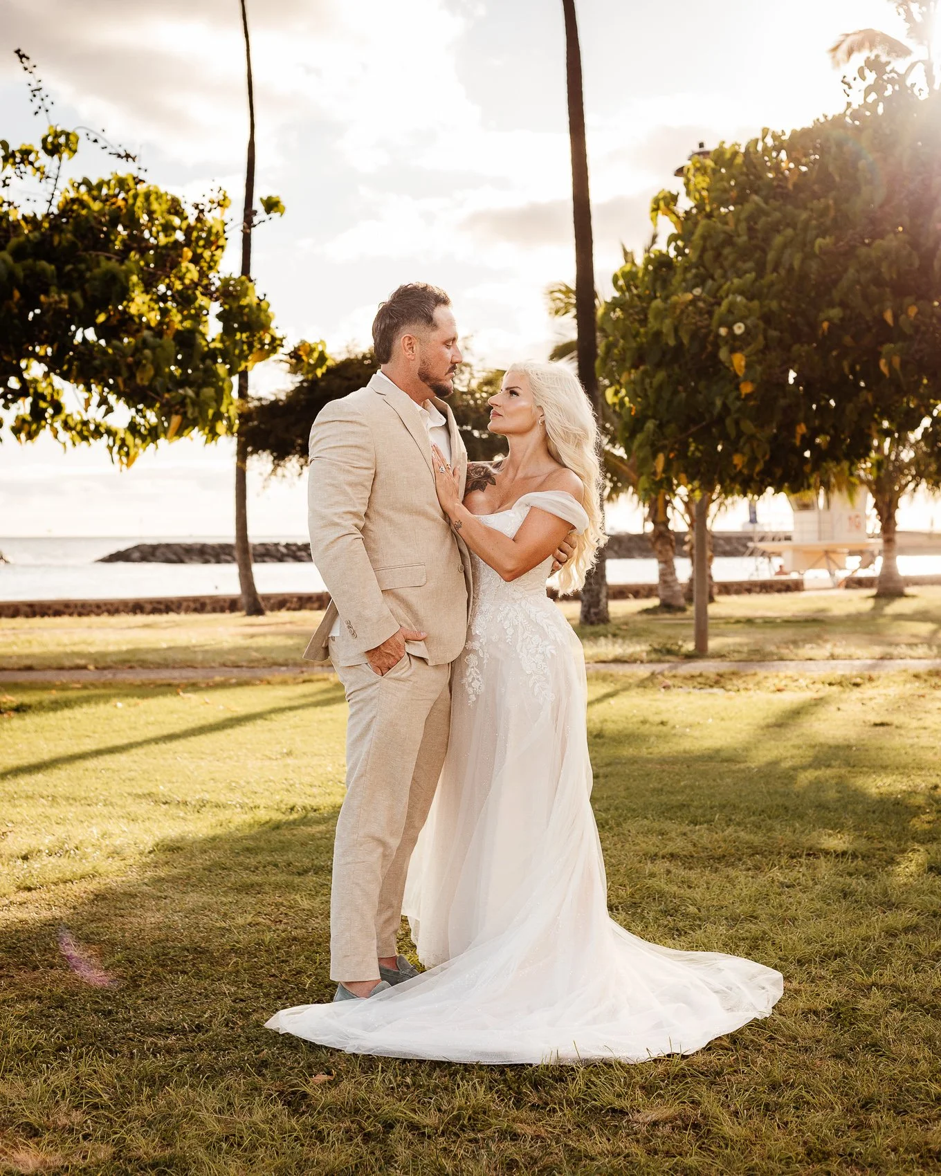 Meg and Ryan got married at Magic Island Beach on the island of Oahu, Hawaii.