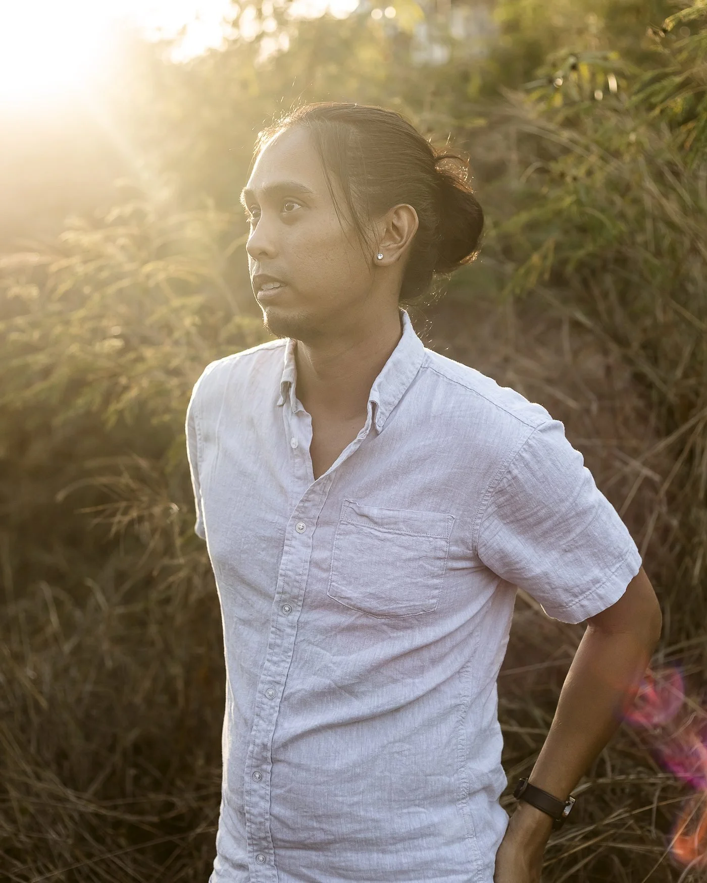 Eddy Nova the photographer standing outdoors with sunlight in background in Honolulu.