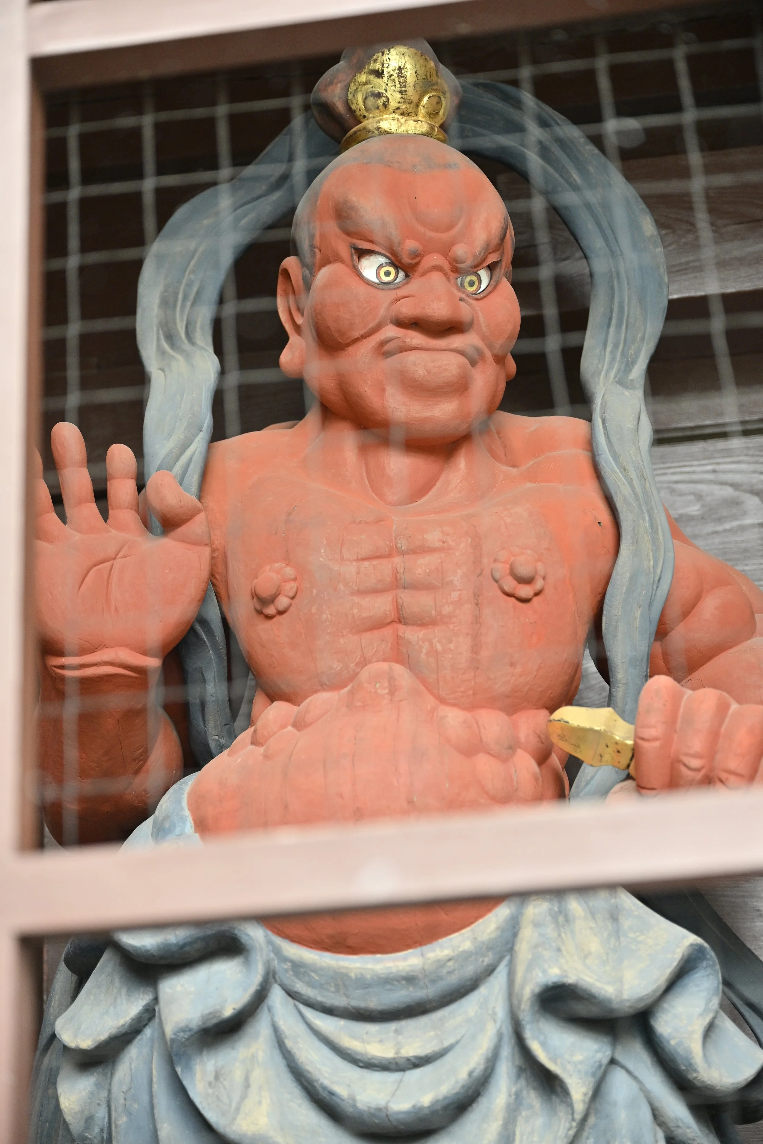The statue guards at the main entrance (Niomon gate) of the Kamakura Great Buddha temple (Kotoku-in) are the Niō (Benevolent Kings), also known as Kongō Rikishi.